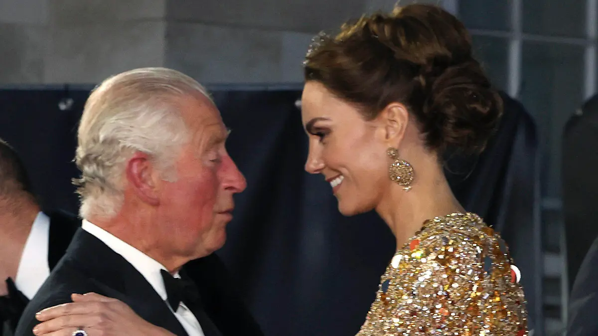 FILE - In this Tuesday, Sept. 28, 2021 file photo, Britain's Prince Charles, left, speaks with Kate, the Duchess of Cambridge as they arrive for the World premiere of the new film from the James Bond franchise 'No Time To Die', in London. Attention on Princess Kate has reached levels not seen since she married Prince William in a fairy-tale wedding in 2011. An admission from Kate that she altered an official family photo triggered a backlash. (Chris Jackson/Pool Photo via AP, File)