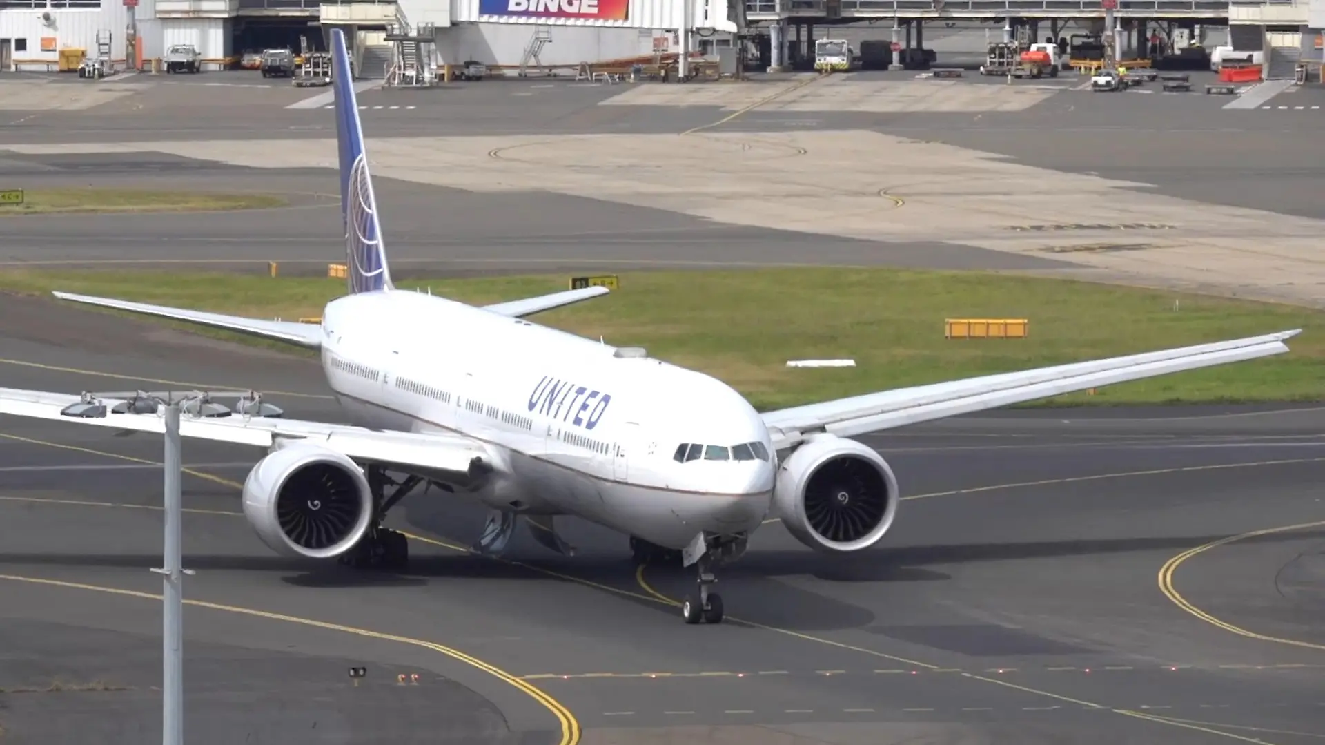 A United Airlines UA830 777-300ER aircraft taxis, with landing gear compartment doors open, after it turned back following take-off at Sydney Airport, in Sydney, Australia March 11, 2024 in this screen grab obtained from social media video. New York Aviation via Youtube/via REUTERS  THIS IMAGE HAS BEEN SUPPLIED BY A THIRD PARTY. MANDATORY CREDIT. NO RESALES. NO ARCHIVES.