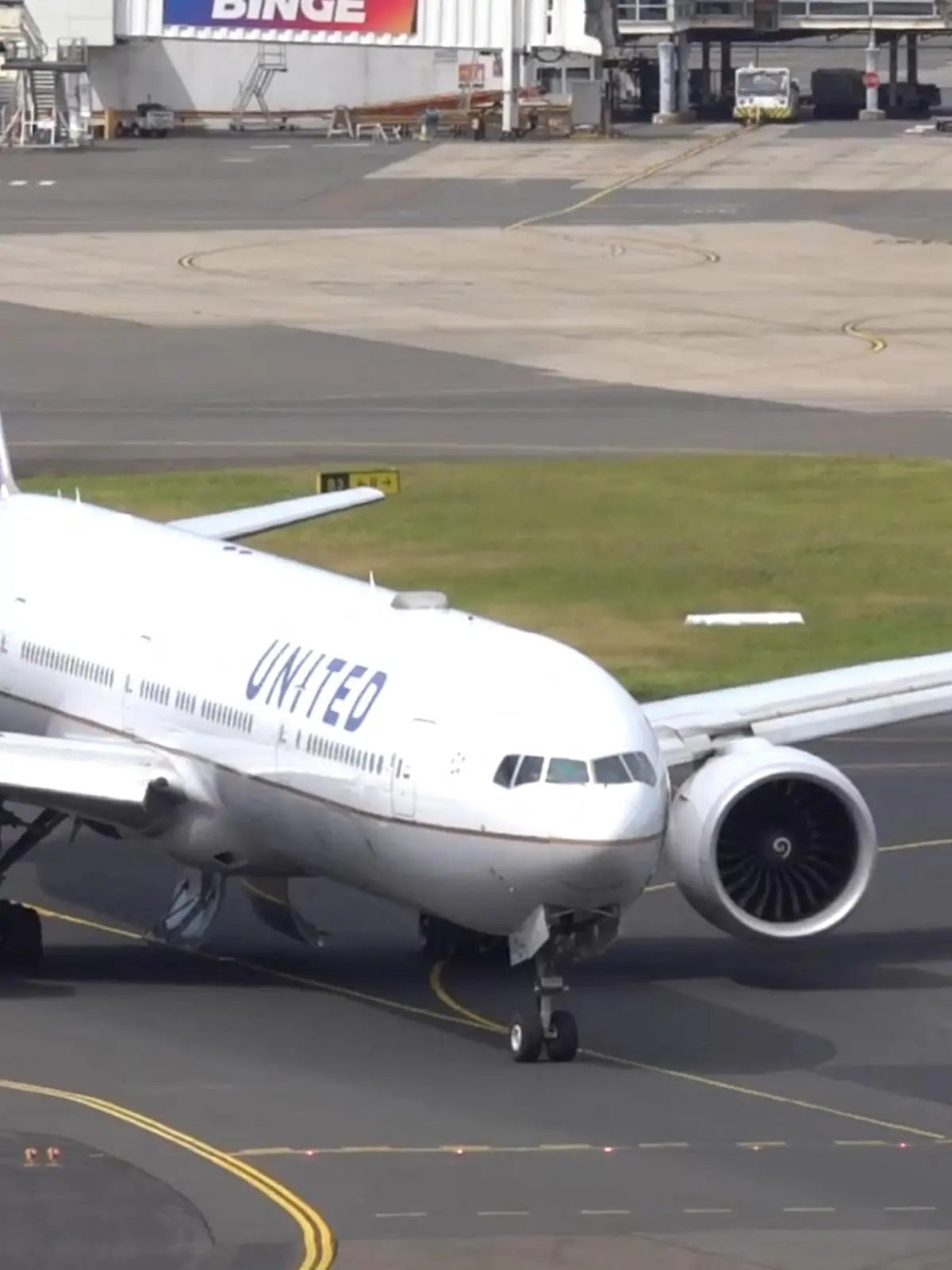 A United Airlines UA830 777-300ER aircraft taxis, with landing gear compartment doors open, after it turned back following take-off at Sydney Airport, in Sydney, Australia March 11, 2024 in this screen grab obtained from social media video. New York Aviation via Youtube/via REUTERS  THIS IMAGE HAS BEEN SUPPLIED BY A THIRD PARTY. MANDATORY CREDIT. NO RESALES. NO ARCHIVES.