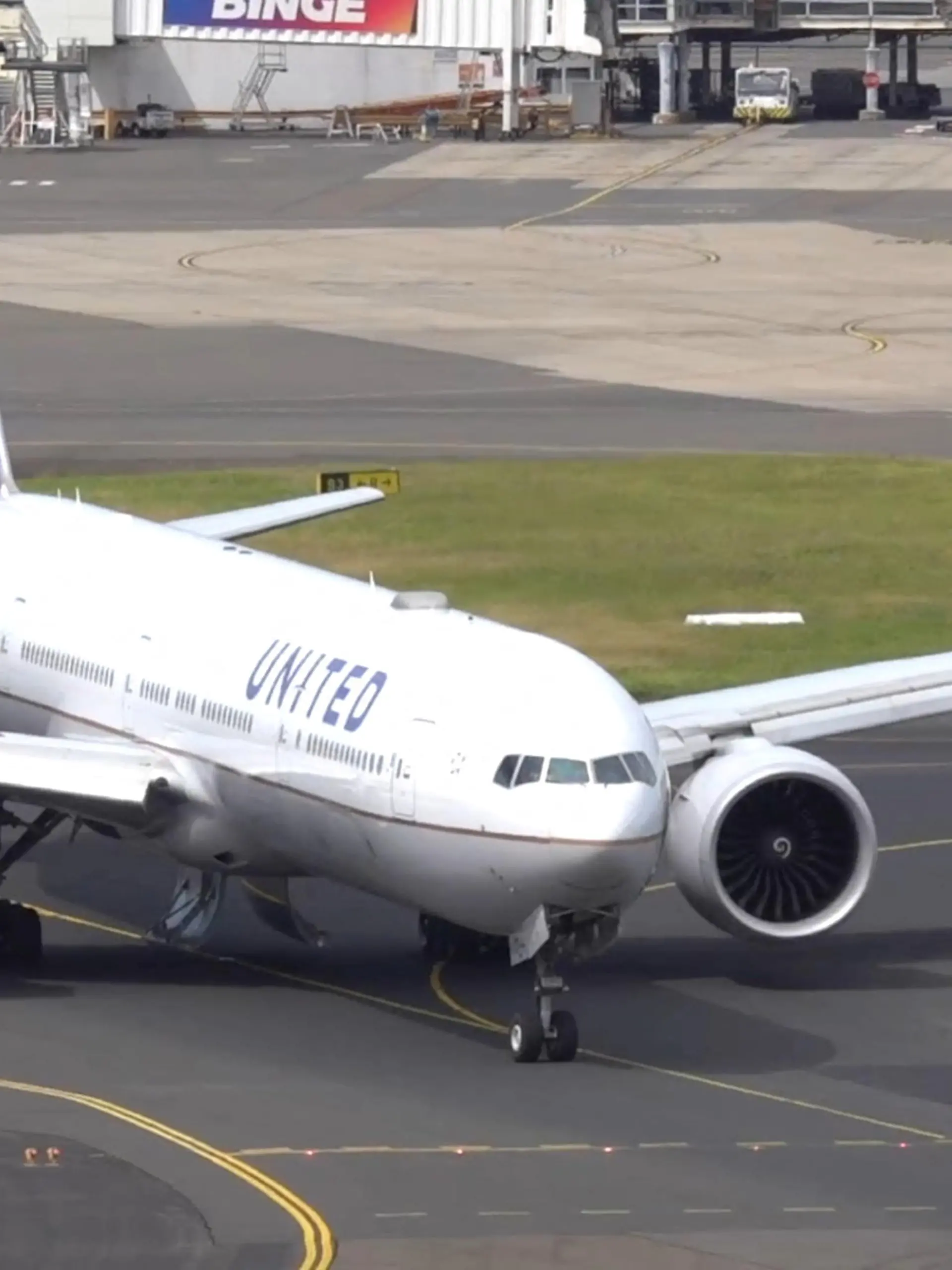 A United Airlines UA830 777-300ER aircraft taxis, with landing gear compartment doors open, after it turned back following take-off at Sydney Airport, in Sydney, Australia March 11, 2024 in this screen grab obtained from social media video. New York Aviation via Youtube/via REUTERS  THIS IMAGE HAS BEEN SUPPLIED BY A THIRD PARTY. MANDATORY CREDIT. NO RESALES. NO ARCHIVES.