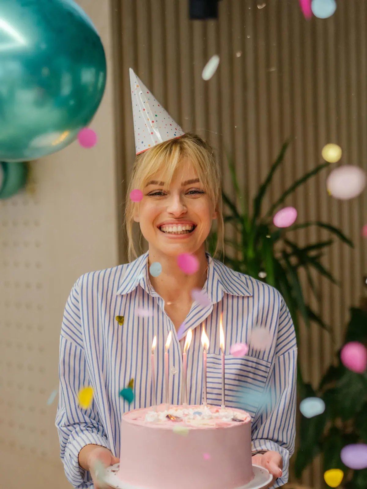 Photo of a young woman celebrating her birthday in the office
