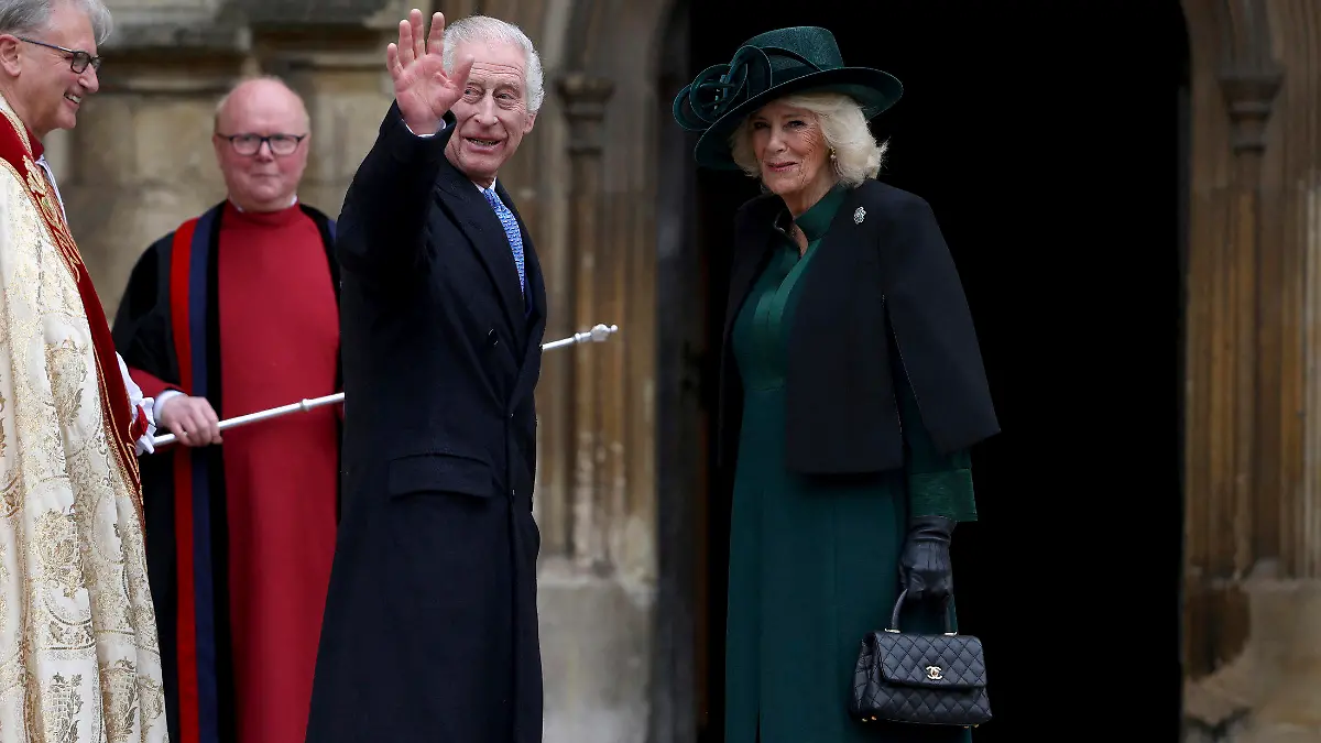 Britain's King Charles III, center, and Queen Camilla arrive to attend the Easter Matins Service at St. George's Chapel, Windsor Castle, England, Sunday, March 31, 2024. (Hollie Adams/Pool Photo via AP)