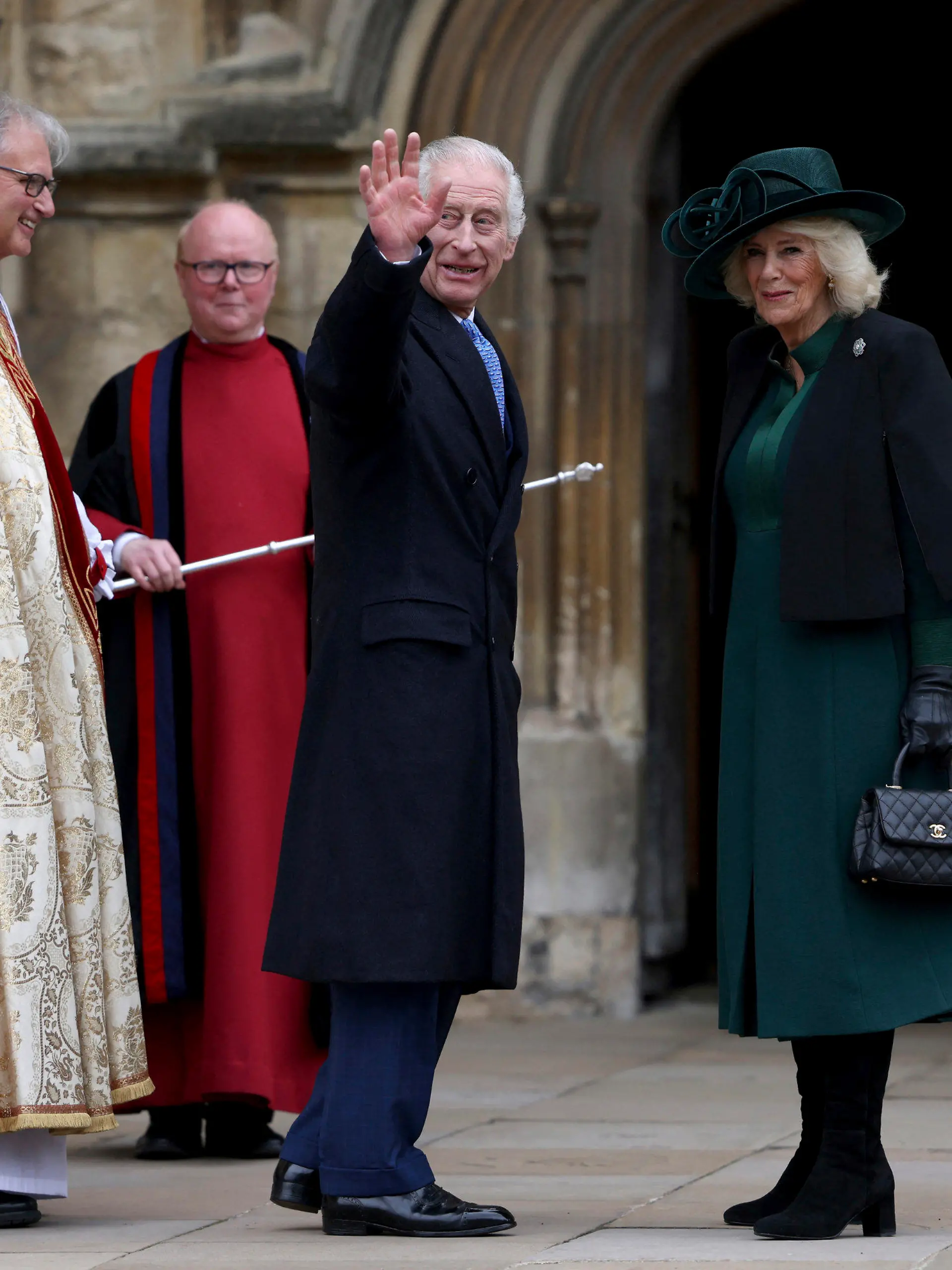 Britain's King Charles III, center, and Queen Camilla arrive to attend the Easter Matins Service at St. George's Chapel, Windsor Castle, England, Sunday, March 31, 2024. (Hollie Adams/Pool Photo via AP)