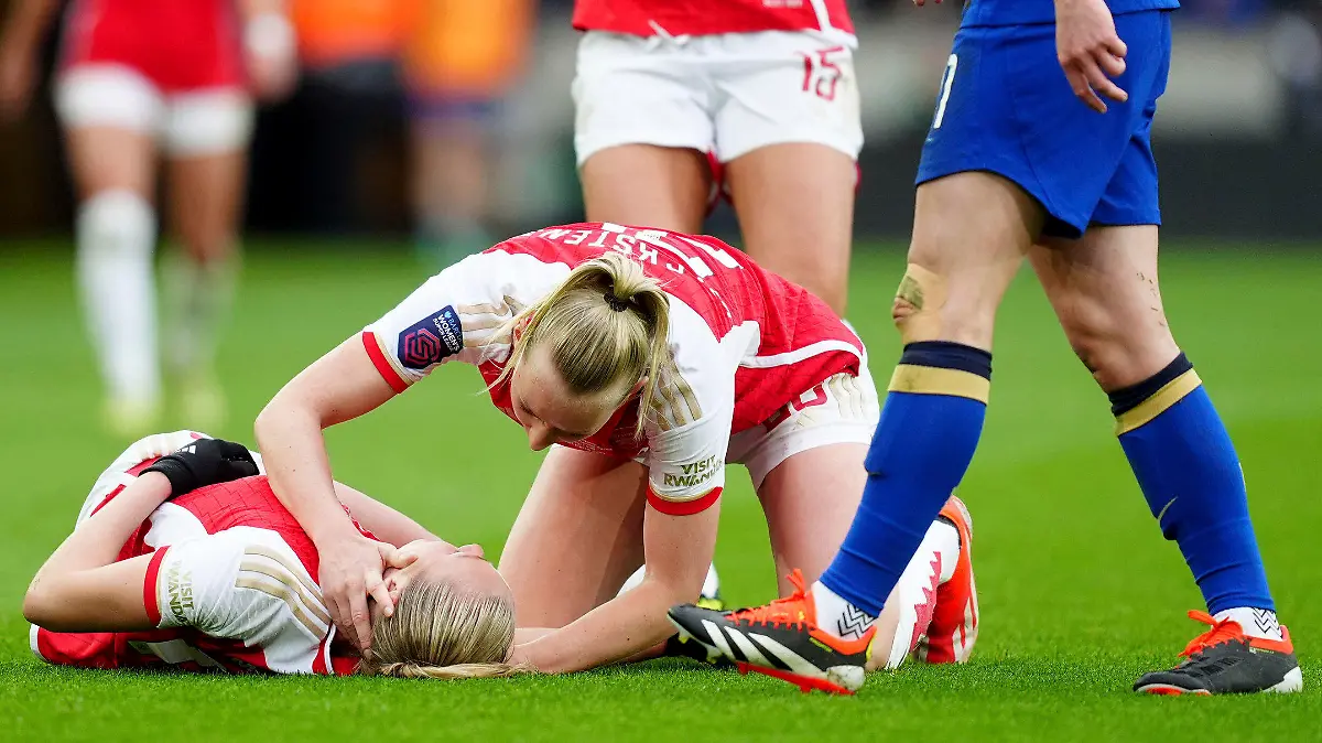Arsenal's Stina Blackstenius checks on team mate Frida Maanum after she goes down during the FA Women's Continental Tyres League Cup Final at Molineux Stadium, Wolverhampton, England, Sunday March 31, 2024. (David Davies/PA via AP)