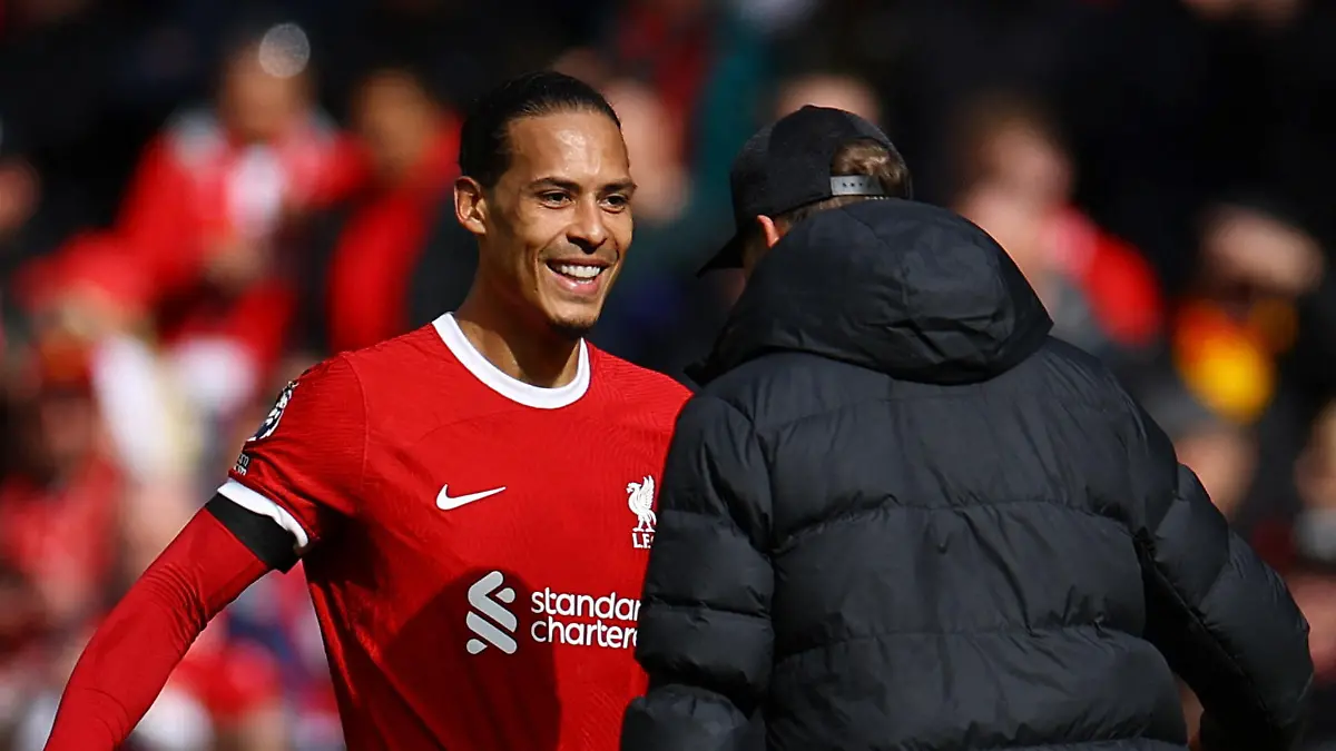 Soccer Football - Premier League - Liverpool v Brighton & Hove Albion - Anfield, Liverpool, Britain - March 31, 2024 Liverpool's Virgil van Dijk and manager Juergen Klopp celebrate after the match REUTERS/Molly Darlington NO USE WITH UNAUTHORIZED AUDIO, VIDEO, DATA, FIXTURE LISTS, CLUB/LEAGUE LOGOS OR 'LIVE' SERVICES. ONLINE IN-MATCH USE LIMITED TO 45 IMAGES, NO VIDEO EMULATION. NO USE IN BETTING, GAMES OR SINGLE CLUB/LEAGUE/PLAYER PUBLICATIONS.