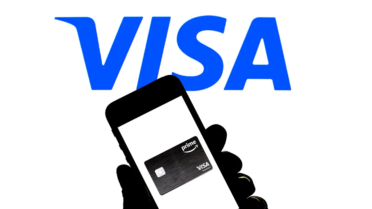 November 23, 2021, Spain: In this photo illustration a Visa Prime card seen displayed on a smartphone with a Visa logo in the background. (Credit Image: © Thiago Prudencio/SOPA Images via ZUMA Press Wire