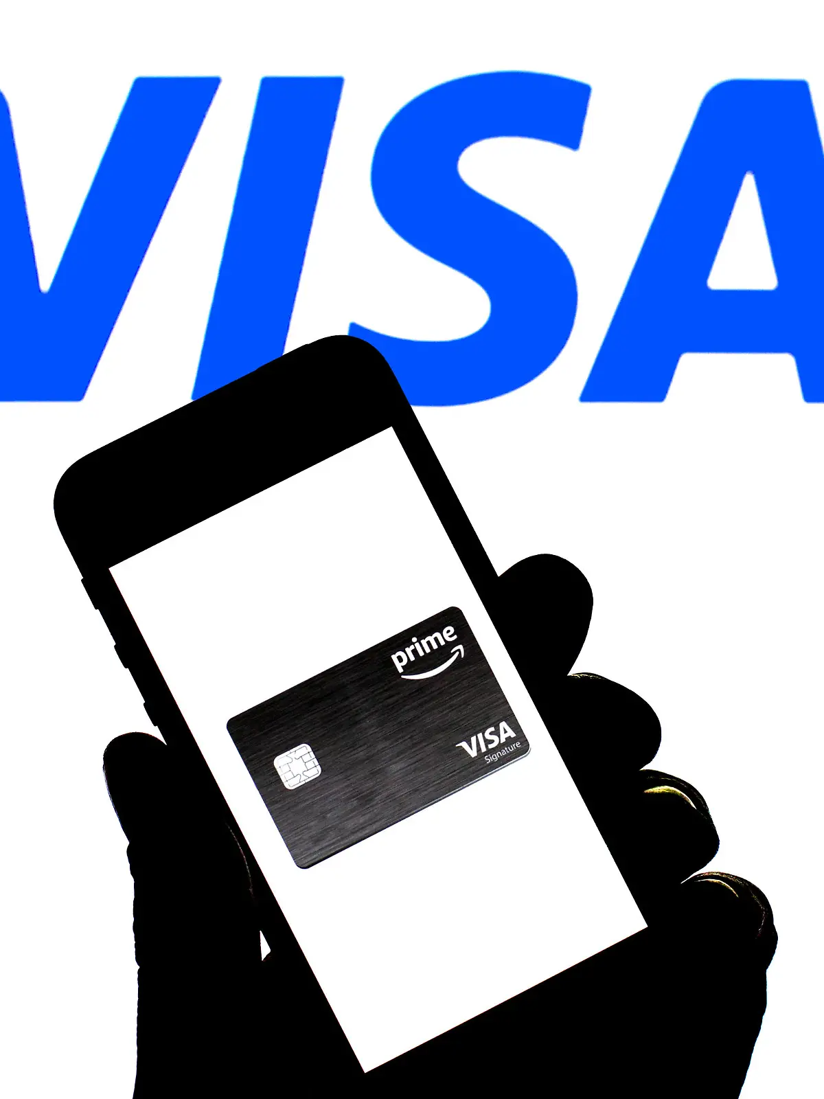 November 23, 2021, Spain: In this photo illustration a Visa Prime card seen displayed on a smartphone with a Visa logo in the background. (Credit Image: © Thiago Prudencio/SOPA Images via ZUMA Press Wire