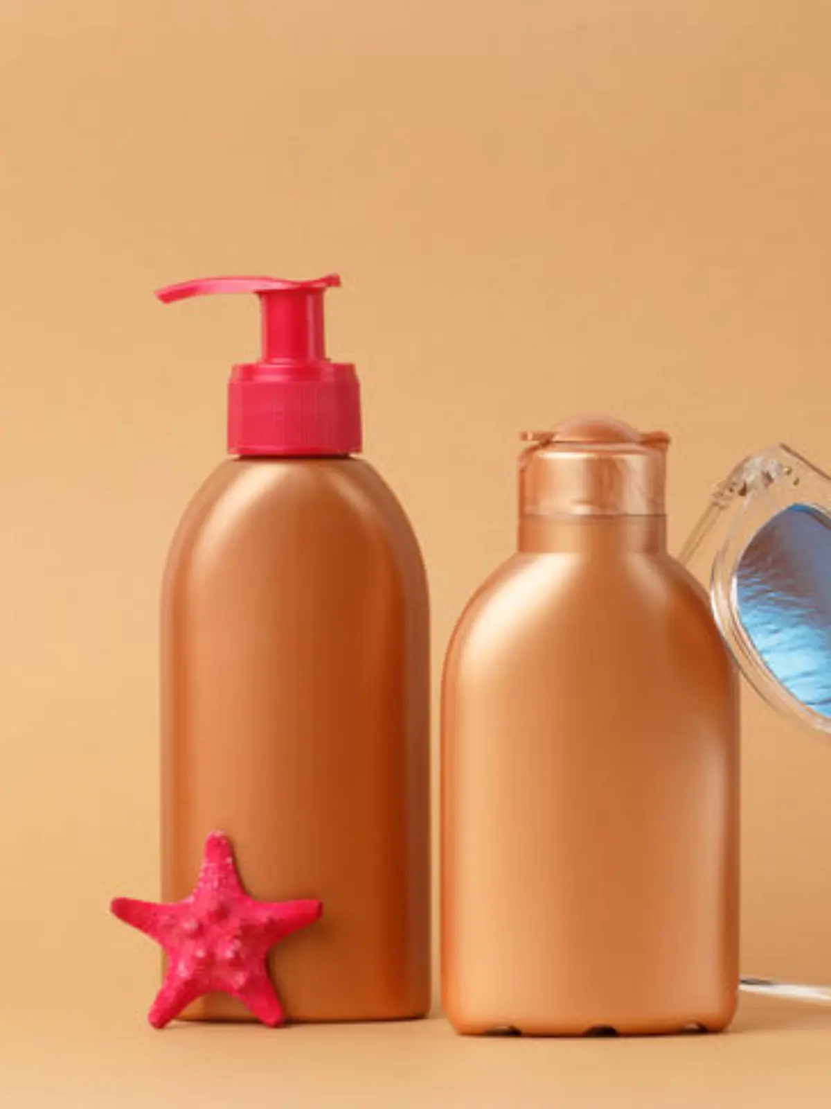 Sunblock ads, sun protection cosmetic products design with moisturizer cream or liquid lotion on bronze, light brown background. Facial and body skin care on the beach, at sea, on summer vacation.