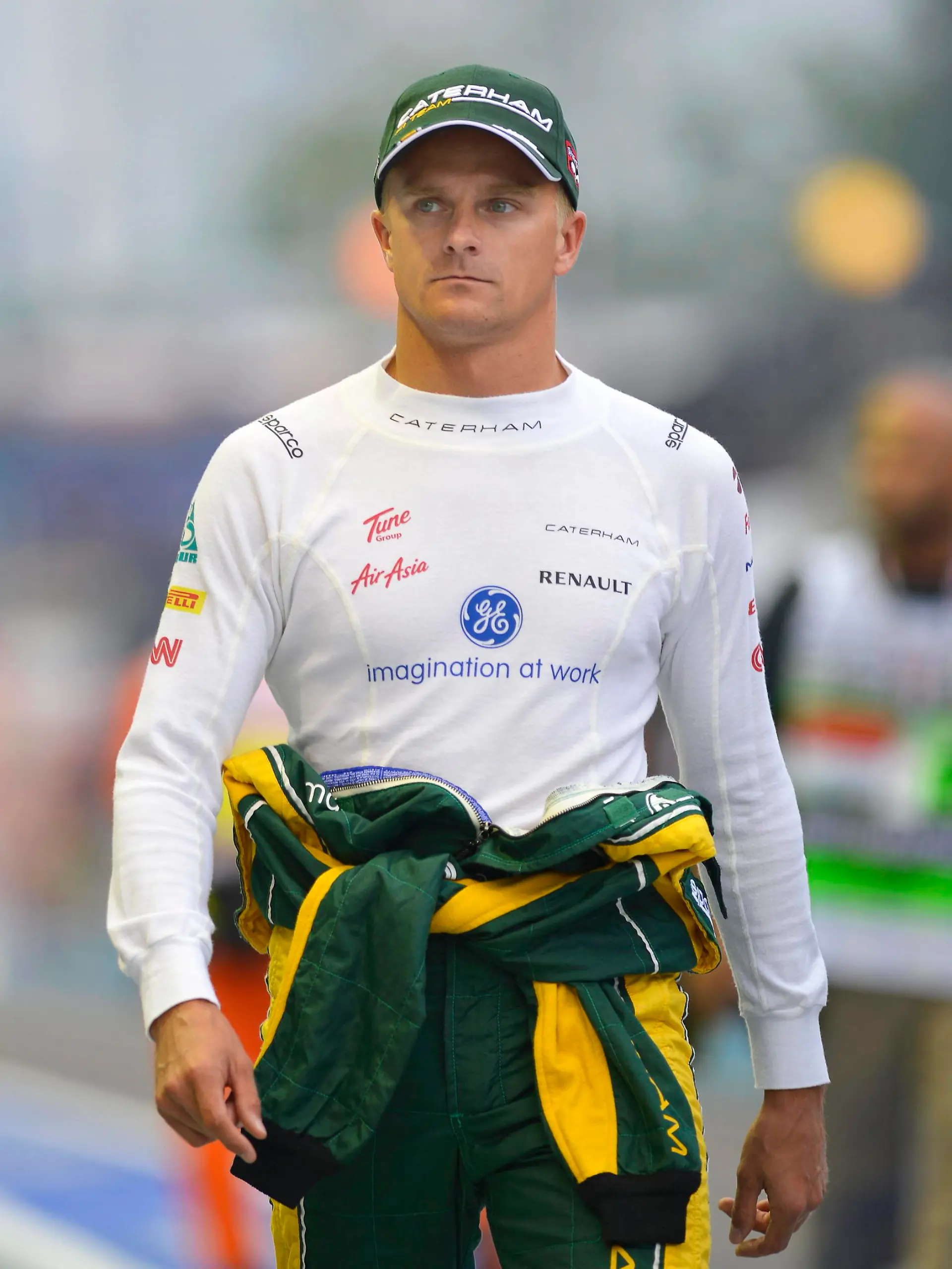 (File) A file picture dated 21 September 2012 shows Finnish Formula One driver Heikki Kovalainen of Caterham walking through the pitlane before the first practice session of the Formula One Singapore Grand Prix at the Marina Bay Street Circuit in Singapore. EPA/FRANCK ROBICHON (zu dpa «Kovalainen soll Räikkönen bei Formel-1-Rennen in Austin ersetzen» am 14.11.2013) +++(c) dpa - Bildfunk+++