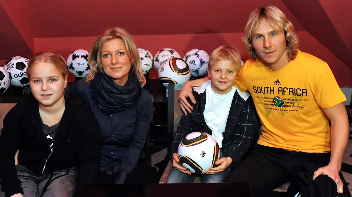 Famous czech soccer player Pavel Nedved introduced the official ball of the World Cup 2010 named Jabulani on December 4, 2009 in Prague, Czech Republic. Pavel Nedved is pictured with his family from the left is daughter Ivana, wife Ivana and son Pavel. (CTK Photo/Michal Dolezal)