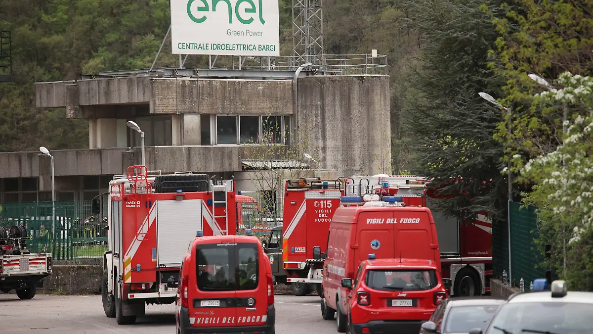 Firefighters vehicles on the site of an explosion occurred at the hydroelectric plant at the Suviana Dam, Italy, Tuesday, April 9, 2024. Italian media are reporting that an explosion at a hydroelectric plant Tuesday in the Apennine Mountains south of Bologna has left at least three people dead and another six reported missing. The explosion occurred at the hydroelectric plant at the Suviana Dam, some 70 kilometers southwest of Bologna. (Michele Nucci/LaPresse via AP)