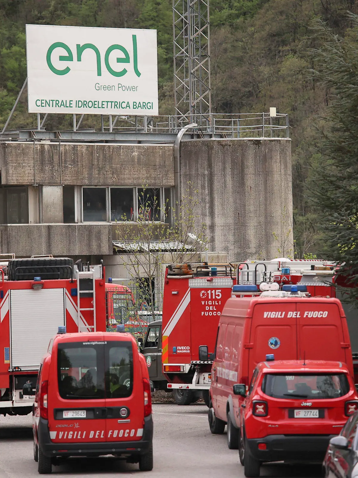 Firefighters vehicles on the site of an explosion occurred at the hydroelectric plant at the Suviana Dam, Italy, Tuesday, April 9, 2024. Italian media are reporting that an explosion at a hydroelectric plant Tuesday in the Apennine Mountains south of Bologna has left at least three people dead and another six reported missing. The explosion occurred at the hydroelectric plant at the Suviana Dam, some 70 kilometers southwest of Bologna. (Michele Nucci/LaPresse via AP)