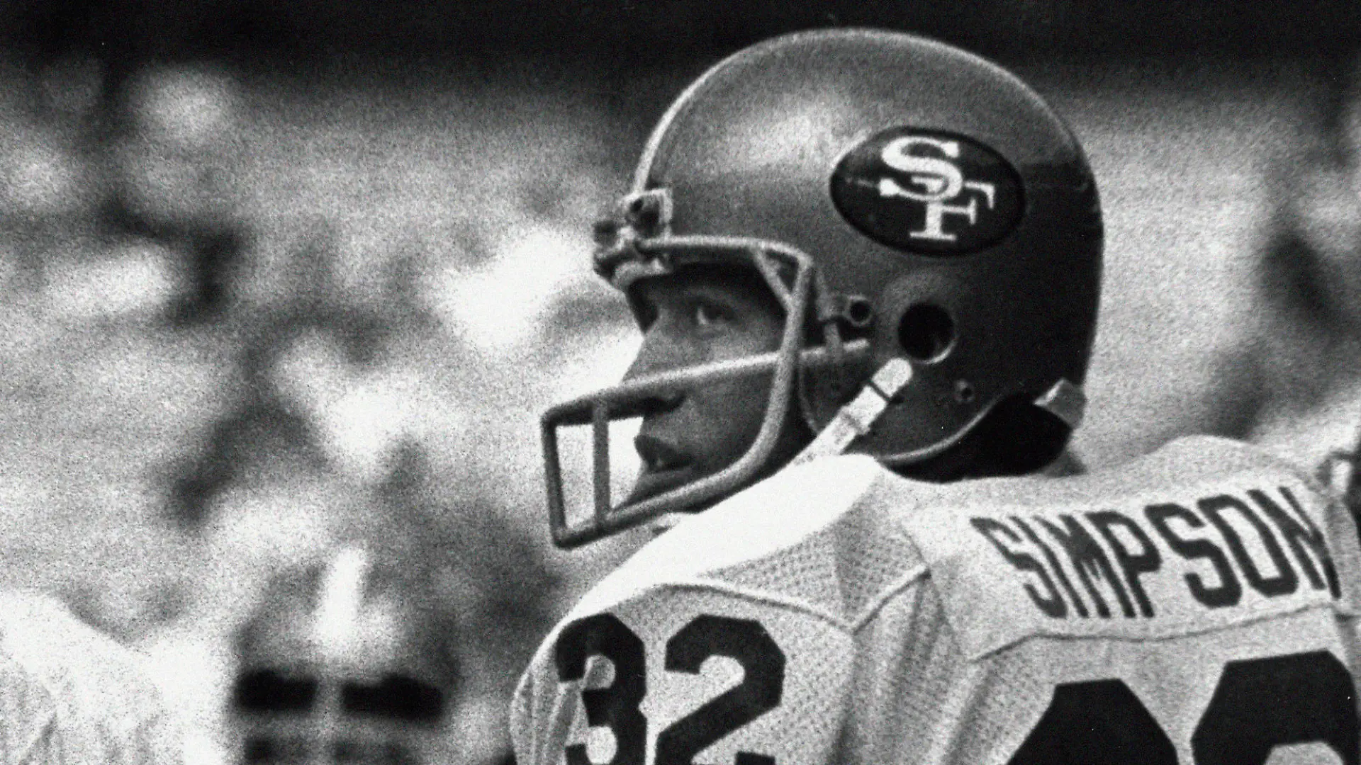FILE - San Francisco 49ers running back O.J. Simpson looks over his shoulder at fans in the stands calling for his attention before an NFL football game against the Atlanta Falcons game in Atlanta, Sunday, Dec. 16 1979. O.J. Simpson, the decorated football superstar and Hollywood actor who was acquitted of charges he killed his former wife and her friend but later found liable in a separate civil trial, has died. He was 76. (AP Photo/Charles Kelly, File)