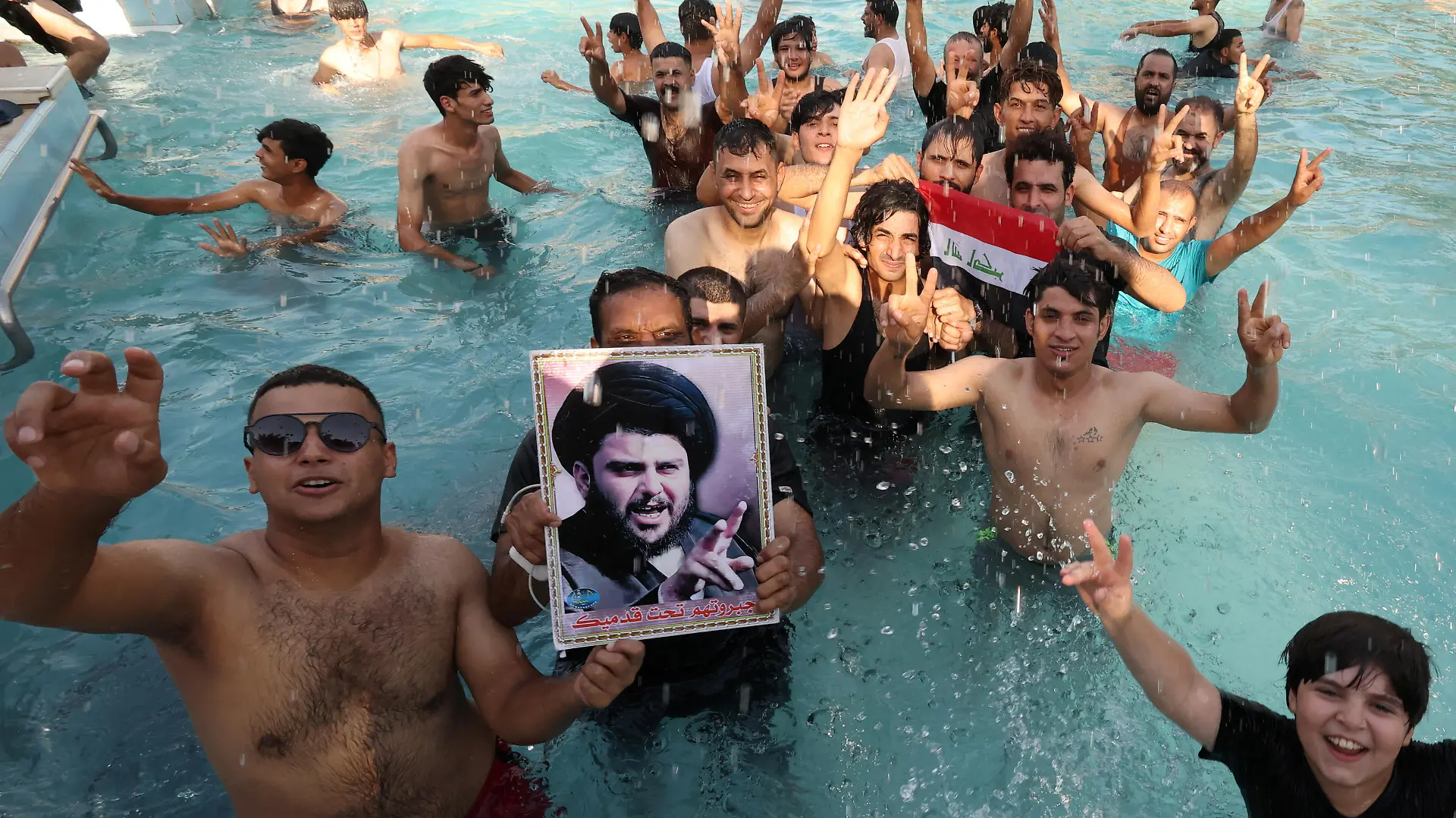 Supporters of Iraqi populist leader Moqtada al-Sadr swim as they protest inside the Republican Palace in the Green Zone, in Baghdad, Iraq August 29, 2022. REUTERS/Alaa Al-Marjani