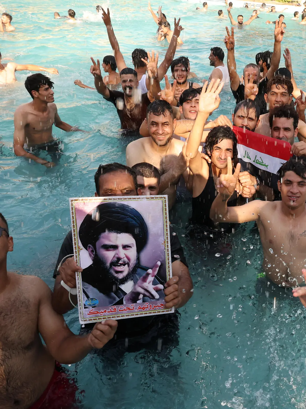 Supporters of Iraqi populist leader Moqtada al-Sadr swim as they protest inside the Republican Palace in the Green Zone, in Baghdad, Iraq August 29, 2022. REUTERS/Alaa Al-Marjani