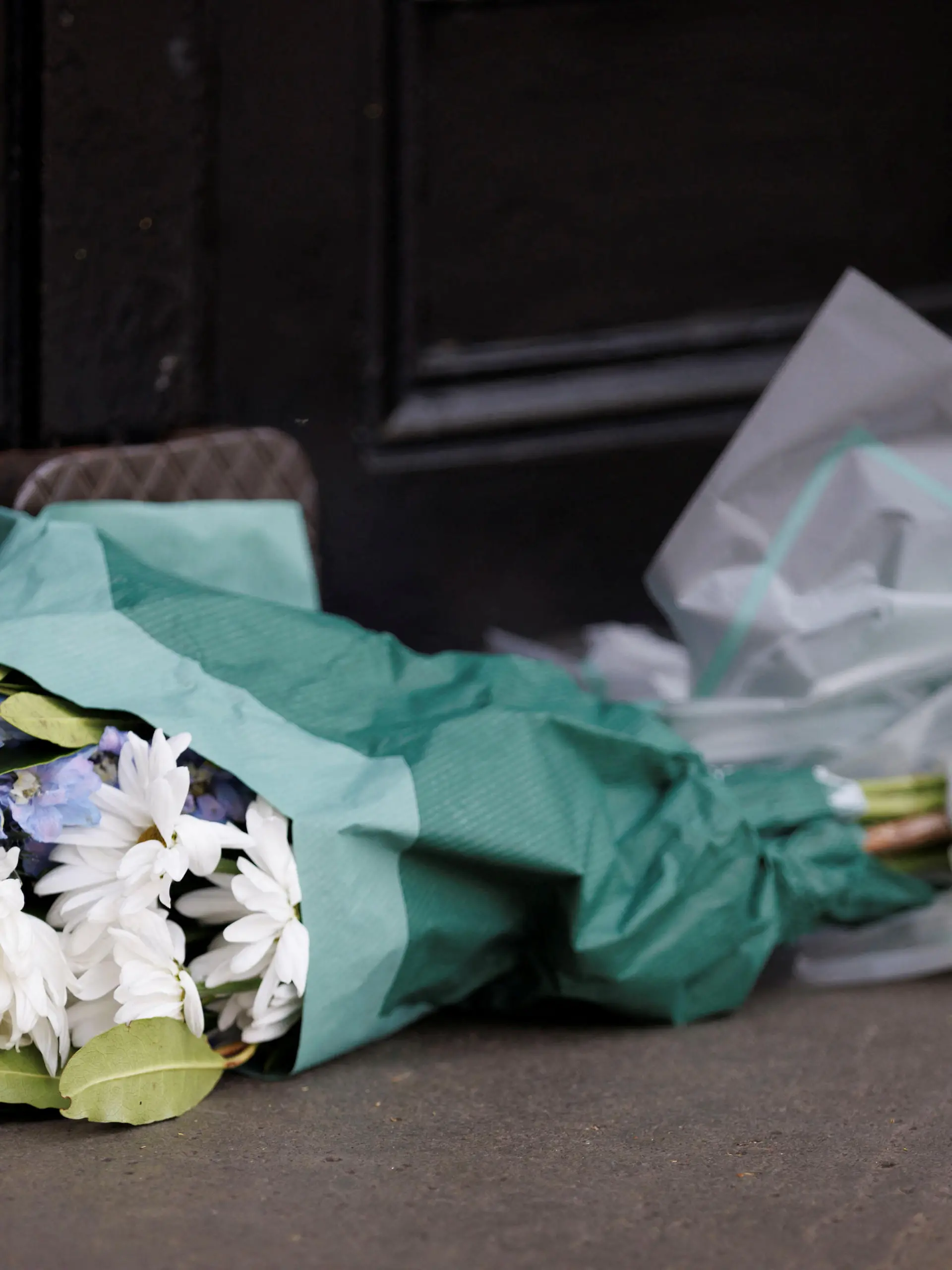 Flowers are laid at Australian Embassy following a fatal stabbing incident in Sydney, in London, Britain, April 13, 2024. REUTERS/ Belinda Jiao