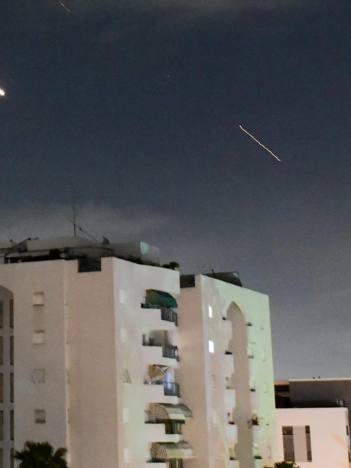 Israeli Iron Dome air defense system launches to intercept missiles fired from Iran, in central Israel, Sunday, April 14, 2024. Iran launched its first direct military attack against Israel on Saturday. The Israeli military says Iran fired more than 100 bomb-carrying drones toward Israel. Hours later, Iran announced it had also launched much more destructive ballistic missiles. (AP Photo/Tomer Neuberg)