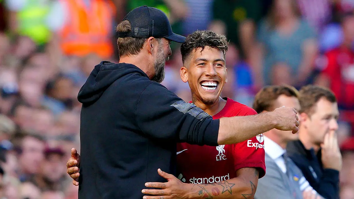 Liverpool v Bournemouth - Premier League - Anfield. Liverpool's Roberto Firmino hugs manager Jurgen Klopp after being substituted during the Premier League match at Anfield, Liverpool. Picture date: Saturday August 27, 2022. See PA story SOCCER Liverpool. Photo credit should read: Peter Byrne/PA Wire. RESTRICTIONS: EDITORIAL USE ONLY No use with unauthorised audio, video, data, fixture lists, club/league logos or "live" services. Online in-match use limited to 120 images, no video emulation. No use in betting, games or single club/league/player publications. URN:68489252