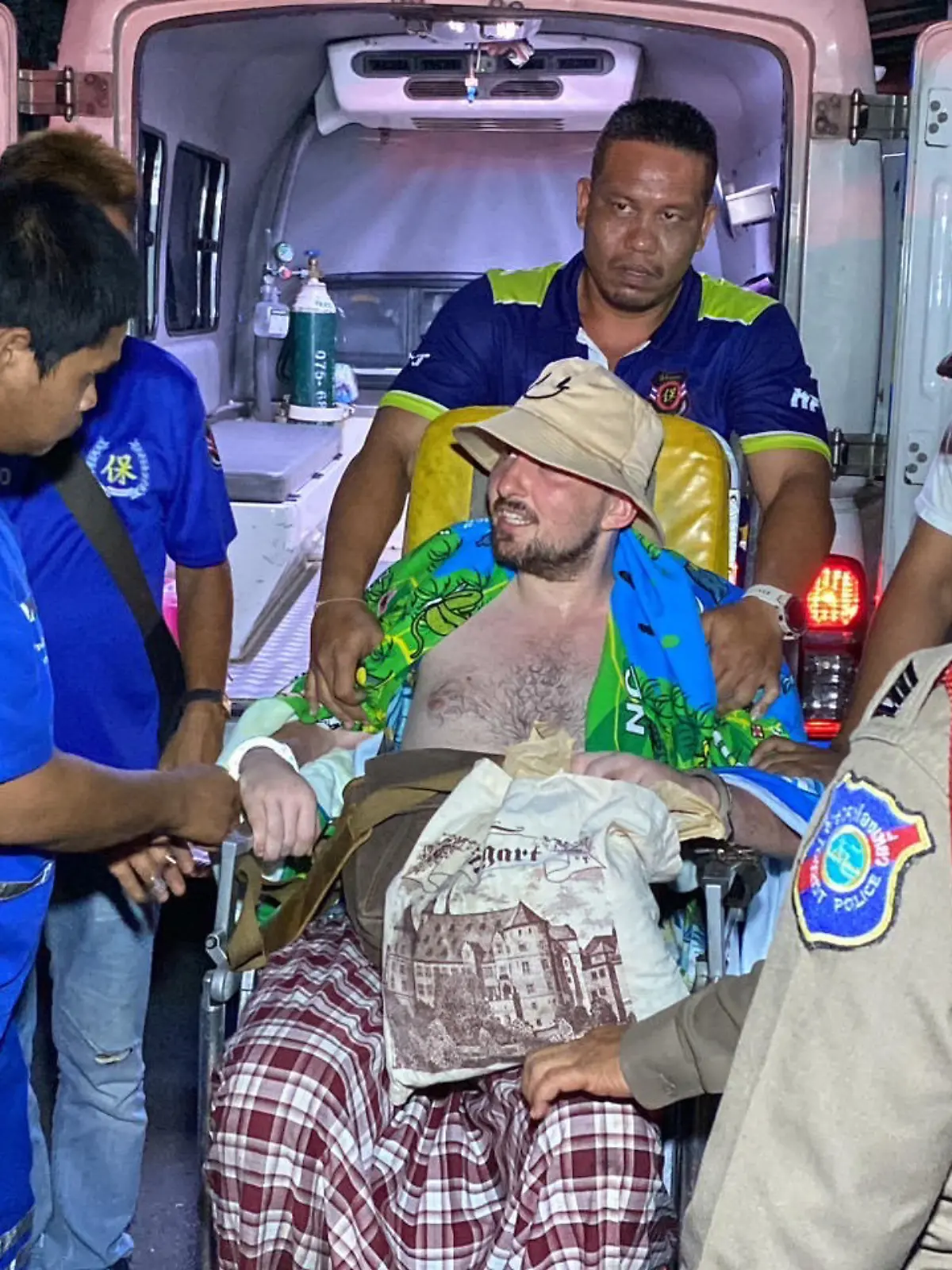 A far-right German politician has been arrested over an alleged drugs-fueled rampage on a Thai island.

Niels Foitzik, a member of the AFD, sparked panic when he allegedly began throwing food and pushing over plates in a restaurant on Koh Phi Phi in southern Thailand on Thursday night, April 11.

Police arrived but could not understand his ramblings. He was fined 1,000 Baht (25.73 Euro) for ‘disorderly conduct and inability to maintain consciousness while on a public road' before being released.

However, Niels, 32, from Berlin, was picked up again the following night. 

He is seen in the video resisting while being bundled into an ambulance by four cops and three paramedics. He was then handcuffed to a stretcher and wheeled into the vehicle.   PACKAGE: Video, pictures, text