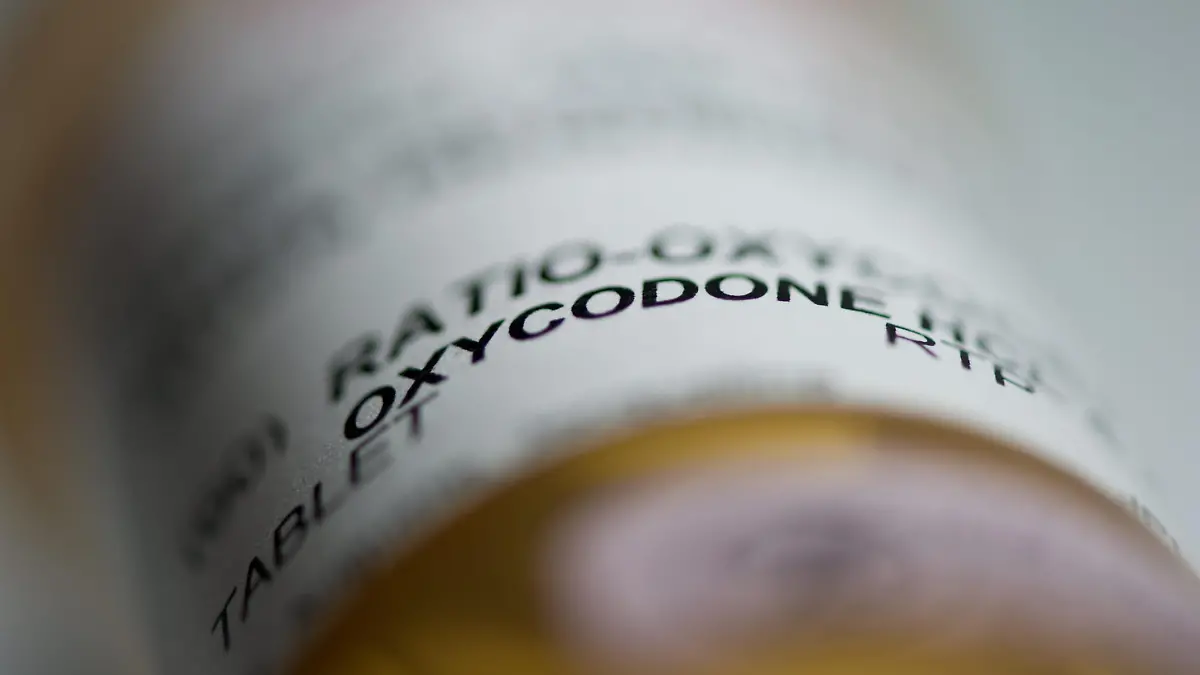 Prescription pill bottle containing oxycodone and acetaminophen are shown in this June 20, 2012 photo. THE CANADIAN PRESS/Graeme Roy (Canadian Press via AP Images)