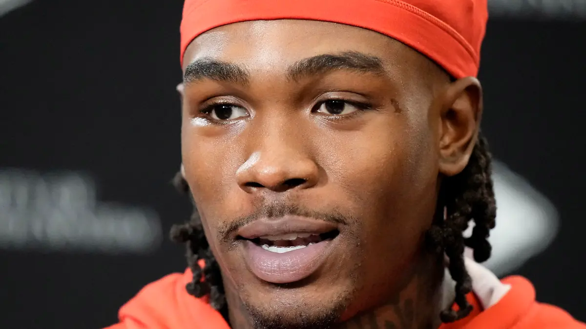 FILE - Kansas City Chiefs wide receiver Rashee Rice speaks to the media before the NFL football team's practice Thursday, Jan. 25, 2024, in Kansas City, Mo. A spokeswoman for Rice’s attorney, Texas state Sen. Royce West, confirmed to The Associated Press, late Thursday, April 11, 2024, that Rice turned himself in at the Glenn Heights Police Department, in Texas, on charges including aggravated assault after he and another driver of a speeding sports car allegedly caused a crash involving a half-dozen vehicles on a Dallas highway the previous month. (AP Photo/Charlie Riedel, File)