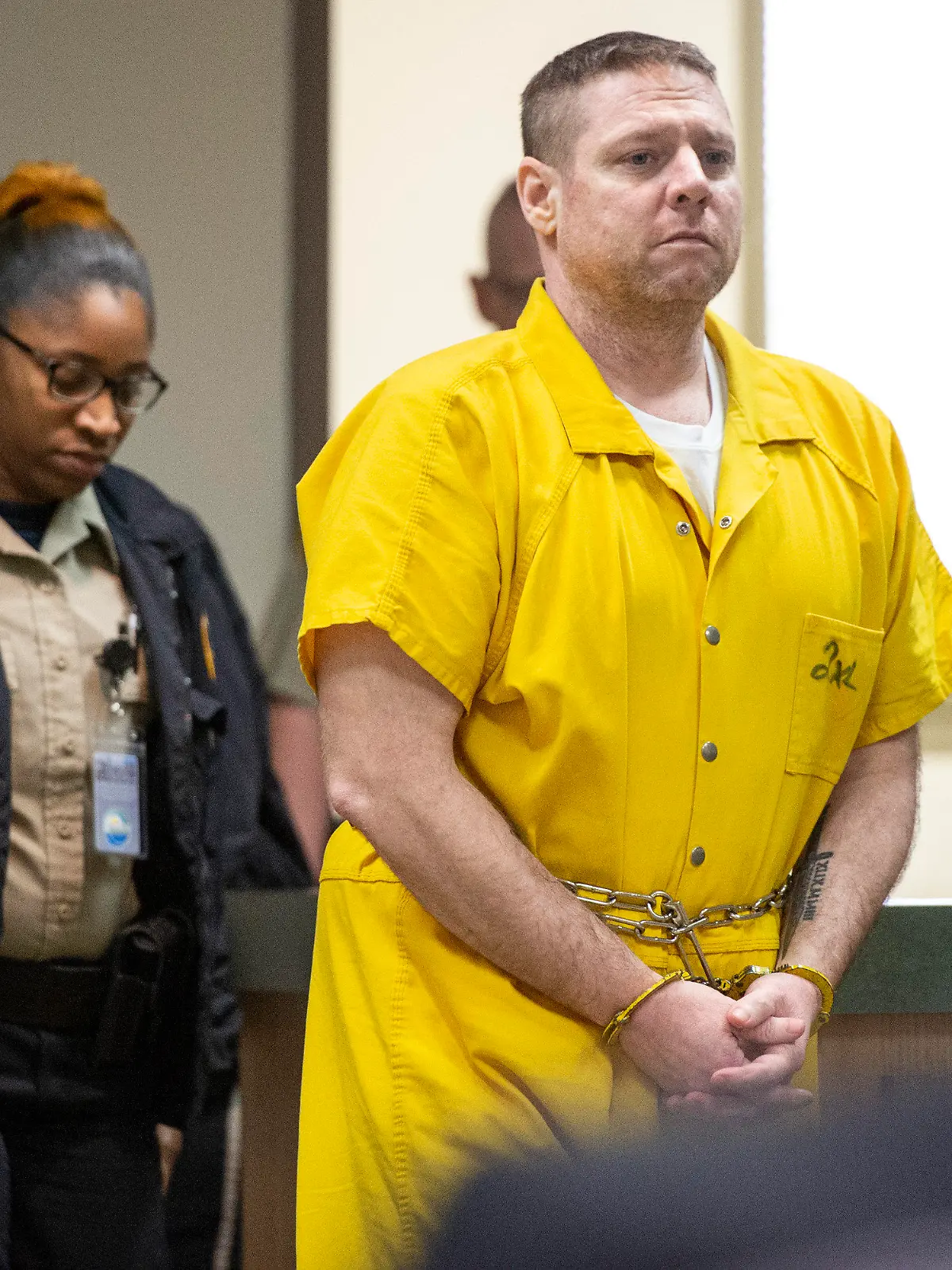 Jacob Blair Scott is led into the courtroom for his sentencing hearing following a trial in which the jury gave its verdict that Scott was guilty on all charges in Jackson County Circuit Court in Pascagoula, Miss., on Thursday, June 2, 2022. Scott, convicted of sexually assaulting a girl and impregnating her when he was 40 and she was 14, was sentenced him to 85 years in prison. (Hannah Ruhoff/The Sun Herald via AP)