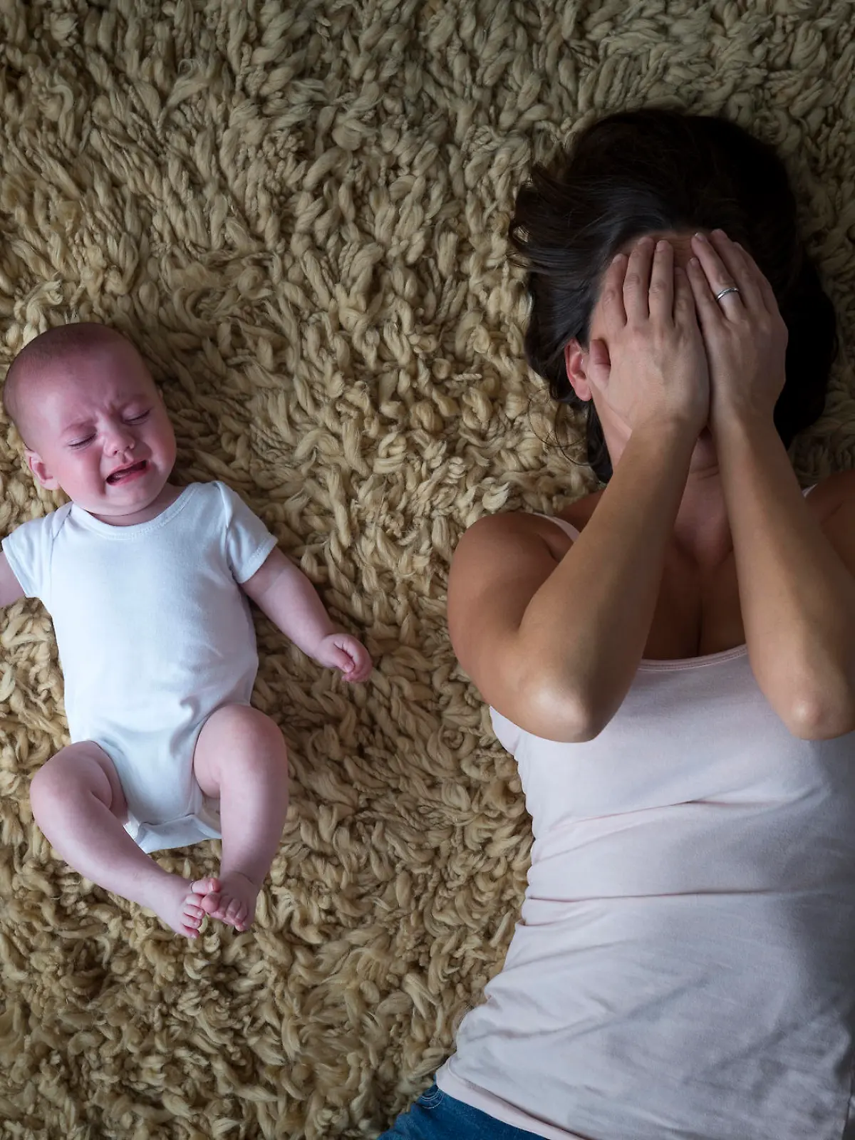 Stressed mother and her baby.