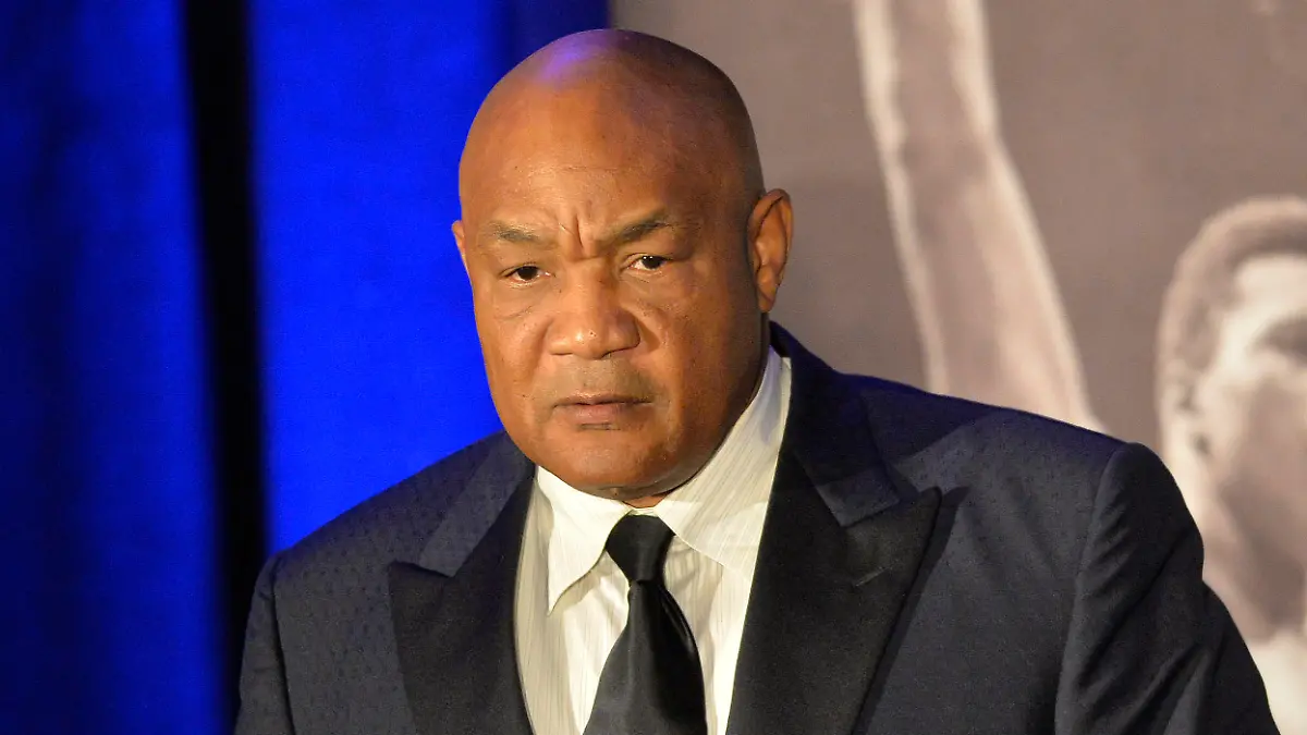 Former heavyweight boxing champion George Foreman gives a stern look to Muhammad Ali during the Sports Illustrated Legacy Awards Thursday, Oct. 1, 2015, in Louisville, Ky. Sports Illustrated announced that it will dedicate the franchise's Sportsman Legacy Award in the name of boxing legend Muhammad Ali. (AP Photo/Timothy D. Easley)