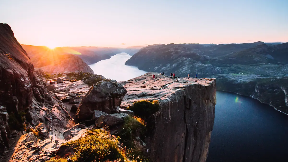 Warm orange sunrise at the Preikestolen in the summer in Norway