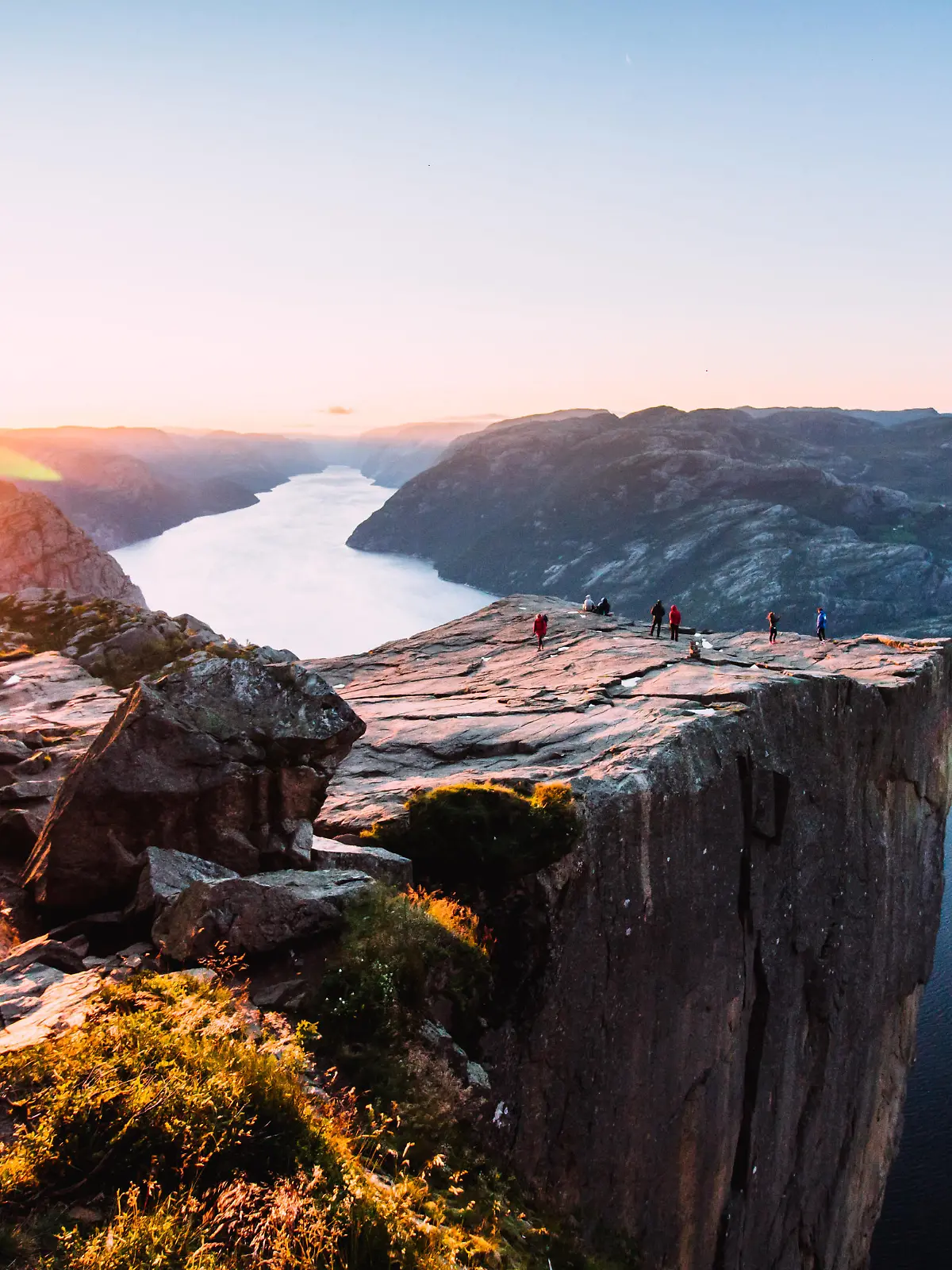 Warm orange sunrise at the Preikestolen in the summer in Norway