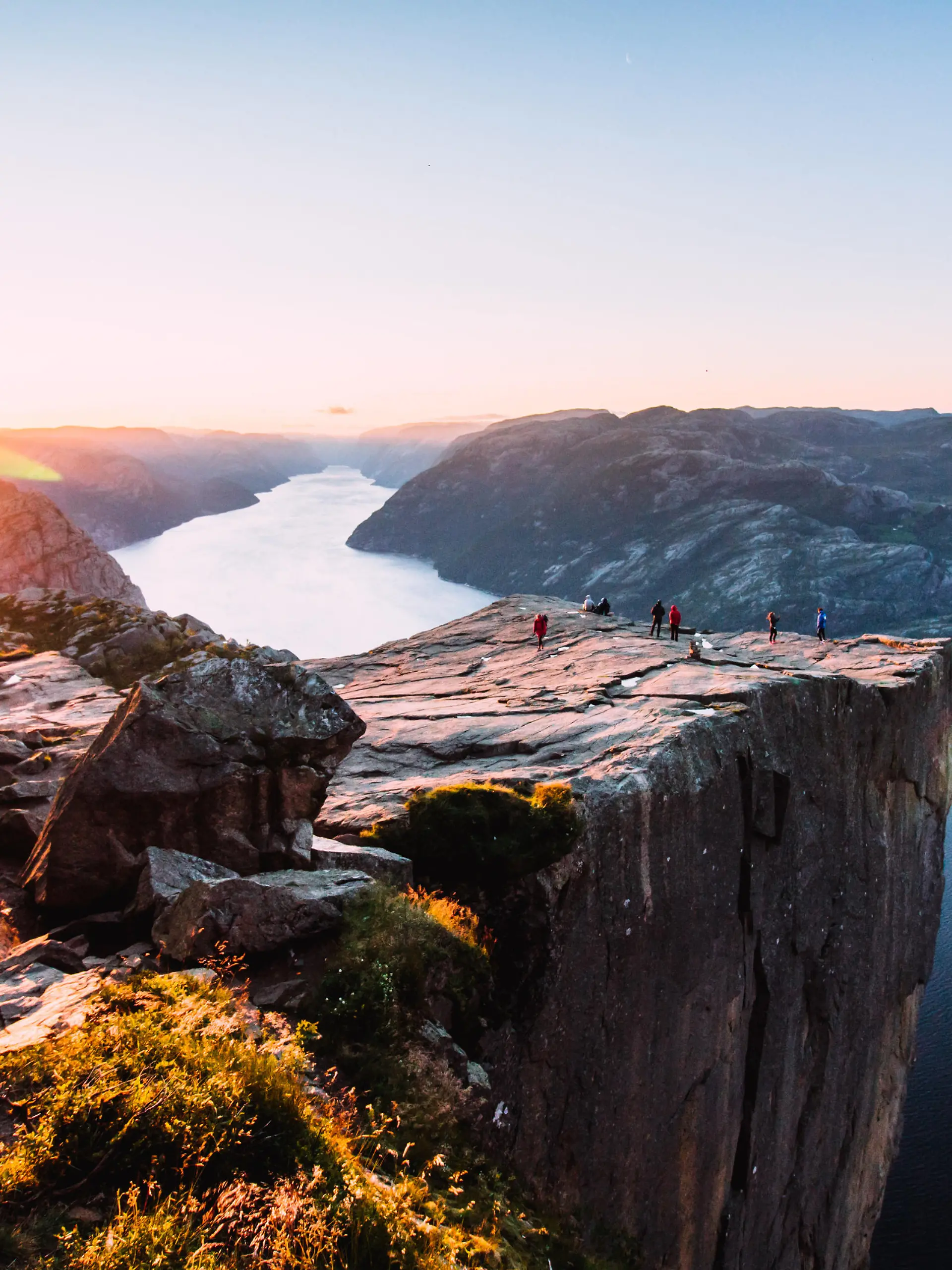Warm orange sunrise at the Preikestolen in the summer in Norway