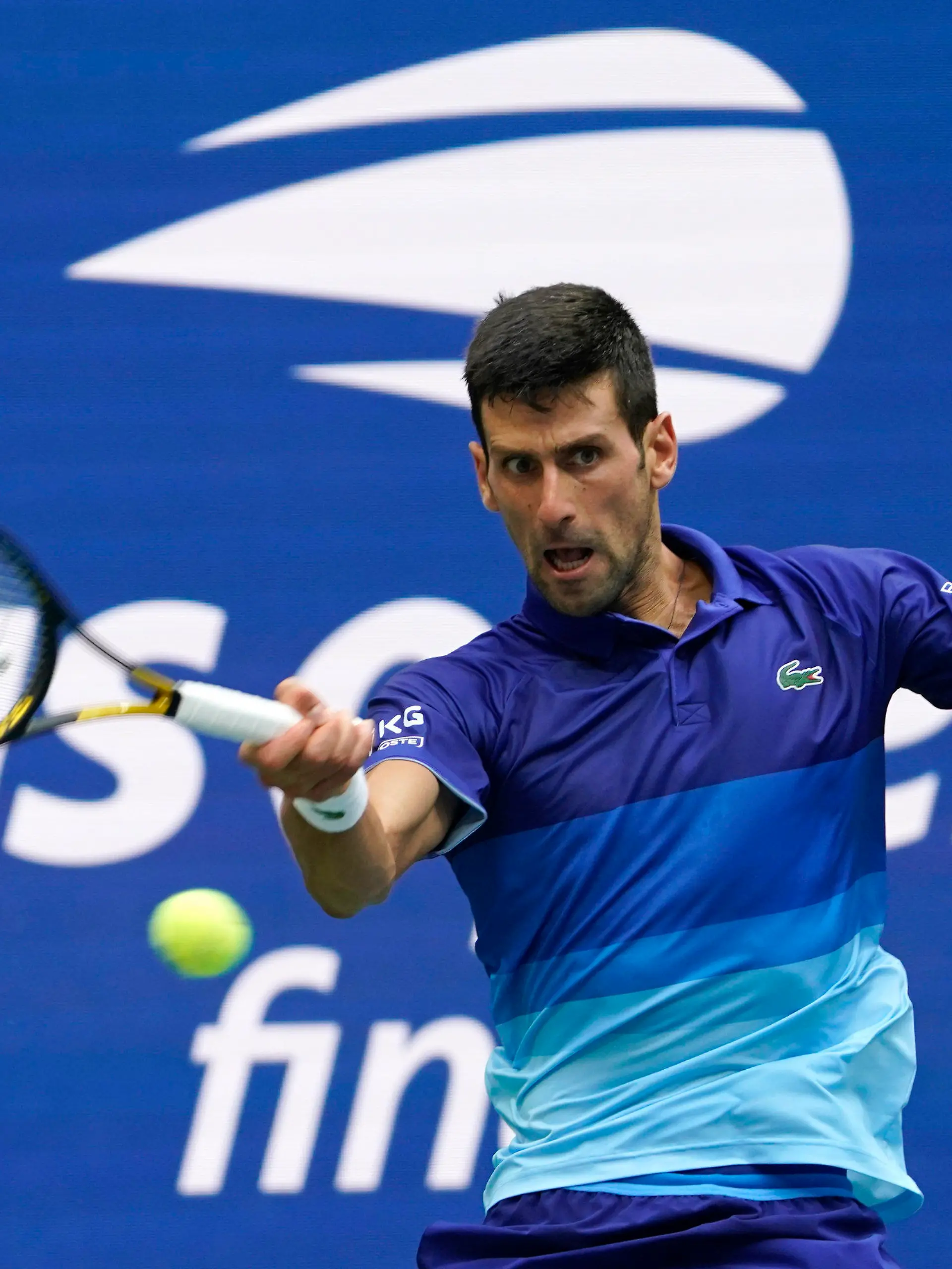 FILE - In this Sept. 12, 2021, file photo, Novak Djokovic, of Serbia, returns a shot to Daniil Medvedev, of Russia, during the men's singles final of the U..S. Open tennis championships in New York. Djokovic will not play in the U.S. Open, as expected, because he is not vaccinated against COVID-19 and thus is not allowed to travel to the United States. Djokovic announced his withdrawal from the year’s last Grand Slam tournament on Twitter on Thursday, Aug. 25, 2022, hours before the draw for the event was revealed. (AP Photo/John Minchillo, File)