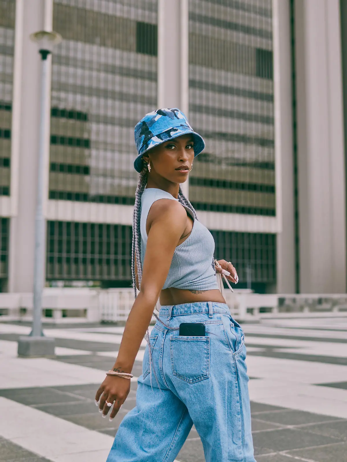 Shot of a trendy young woman walking through the city