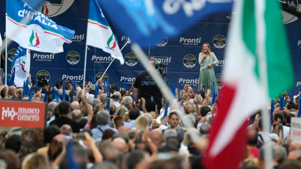 Right-wing party Brothers of Italy's leader Giorgia Meloni addresses a rally as she starts her political campaign ahead of Sept. 25 general elections, in Ancona, Italy, Tuesday, Aug. 23, 2022. (AP Photo/Domenico Stinellis)