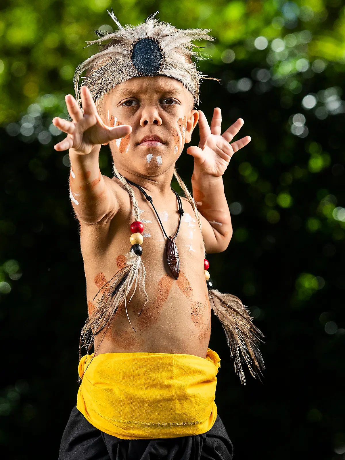 BRISBANE, AUSTRALIA - APRIL 13: Quaden Bayles poses for a portrait on April 13, 2020 in Brisbane, Australia. 9-year-old Quaden Bayles, who born with achondroplasia dwarfism, is an Aboriginal Australian from the Wirri nation of central Queensland. He is wearing a traditional corroboree dress specially made for him by family members. (Photo by Jono Searle/Getty Images)