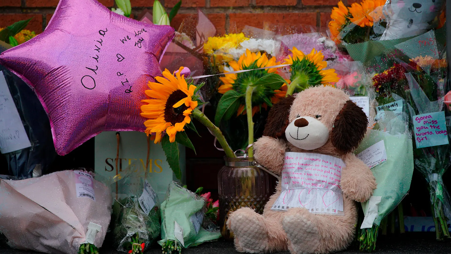 Olivia Pratt-Korbel death. Tributes left in Kingsheath Avenue, Knotty Ash, Liverpool, where nine-year-old Olivia Pratt-Korbel was fatally shot on Monday night. The people of Liverpool have been urged to turn in the masked gunman who killed Olivia as he chased his intended target into her home. Picture date: Wednesday August 24, 2022. A 35-year-old man, unknown to her family, ran into their terraced house in an attempt to get away from a shooter. Olivia's mother Cheryl Korbel, 46, was shot in the wrist as she tried to close the door on the gunman while Olivia stood behind her. See PA story POLICE KnottyAsh. Photo credit should read: Peter Byrne/PA Wire URN:68443930