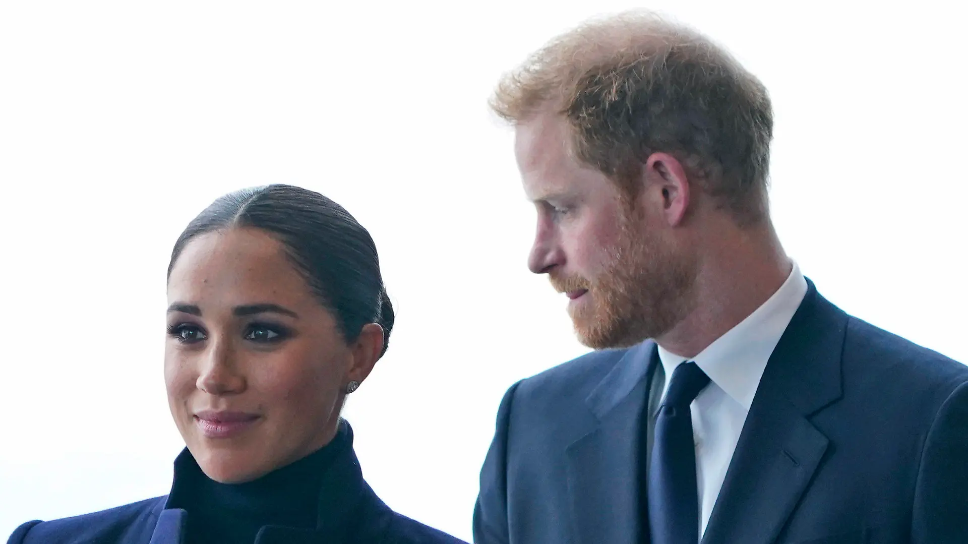 FILE - Meghan Markle, and her husband Prince Harry arrive to the observatory in One World Trade in New York, Thursday, Sept. 23, 2021. After months of speculation about whether they would be invited to the coronation, the palace announced that Harry would attend but Meghan would remain in California with their two children. (AP Photo/Seth Wenig, File)