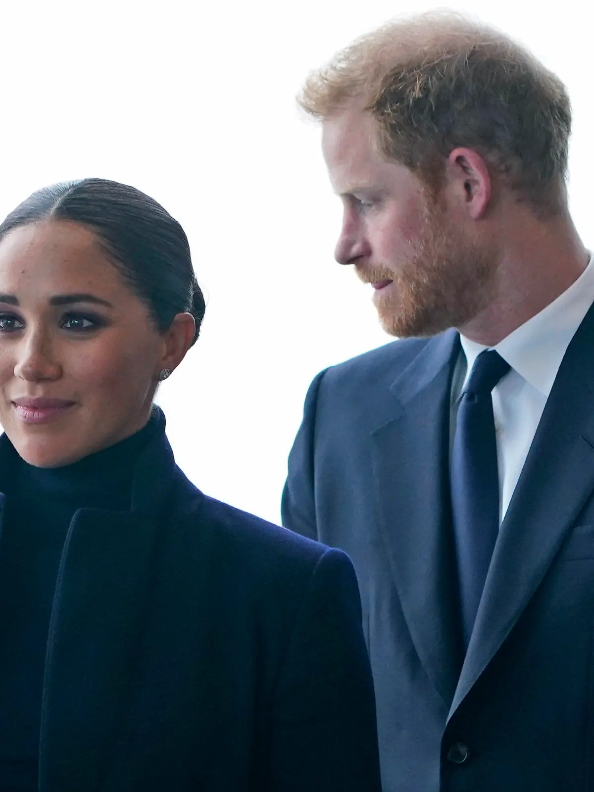 FILE - Meghan Markle, and her husband Prince Harry arrive to the observatory in One World Trade in New York, Thursday, Sept. 23, 2021. After months of speculation about whether they would be invited to the coronation, the palace announced that Harry would attend but Meghan would remain in California with their two children. (AP Photo/Seth Wenig, File)