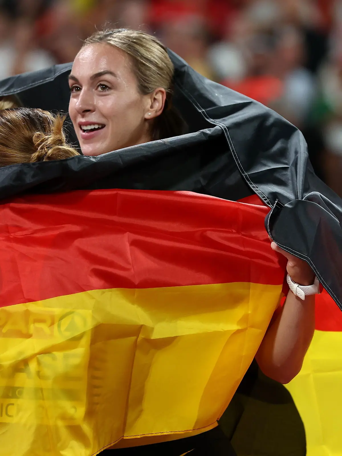 MUNICH, GERMANY - AUGUST 21: Gold medalists Lisa Mayer, Rebekka Haase  and Alexandra Burghardt of Germany celebrate after the Athletics - Women's 4x100m Relay Final on day 11 of the European Championships Munich 2022 at Olympiapark on August 21, 2022 in Munich, Germany. (Photo by Alexander Hassenstein/Getty Images)