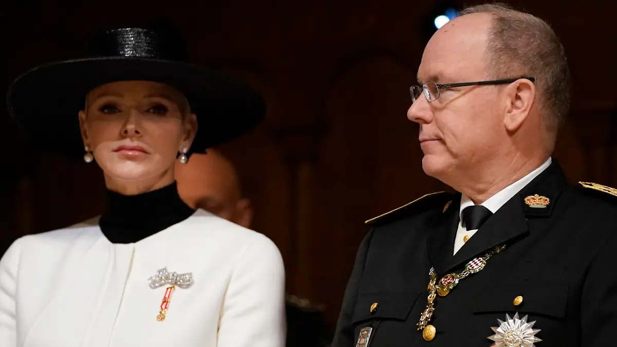 Prince Albert of Monaco, right, and Princess Charlene, left, attend a mass ceremony at the Monaco cathedral as part of ceremonies marking National Day, in Monaco, Saturday Nov.19, 2022. (AP Photo/Daniel Cole, Pool)