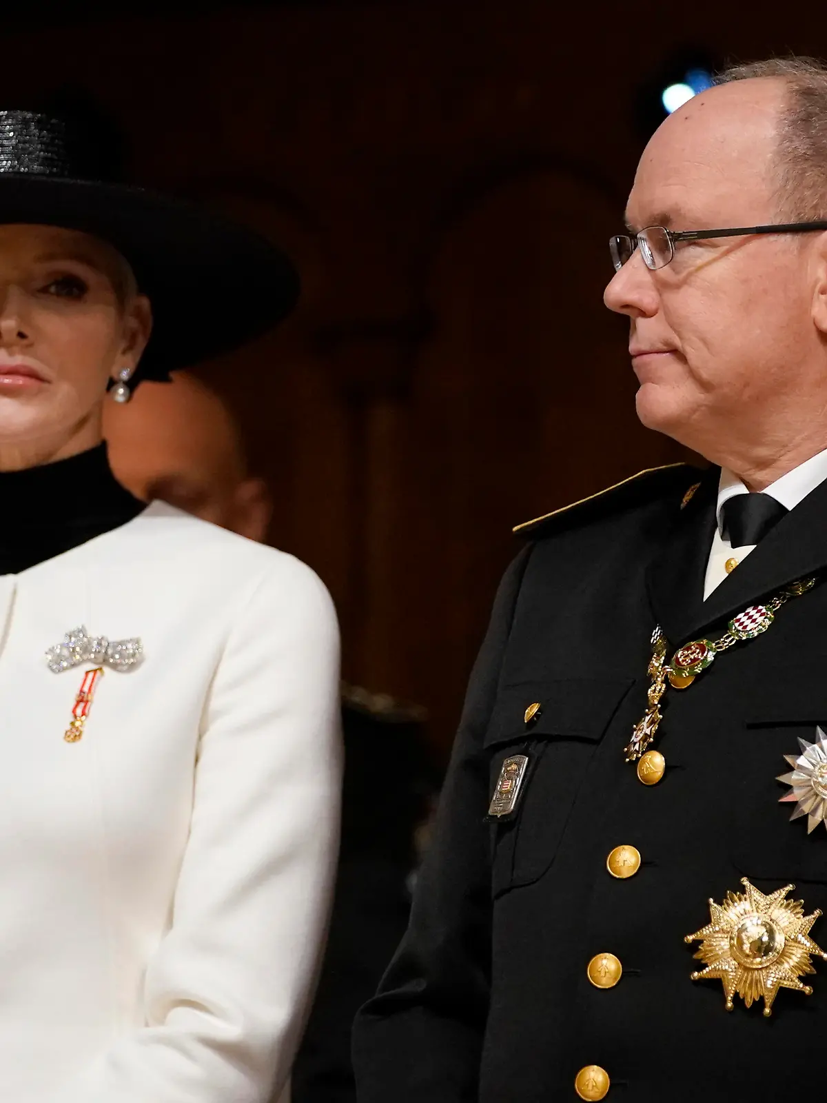 Prince Albert of Monaco, right, and Princess Charlene, left, attend a mass ceremony at the Monaco cathedral as part of ceremonies marking National Day, in Monaco, Saturday Nov.19, 2022. (AP Photo/Daniel Cole, Pool)