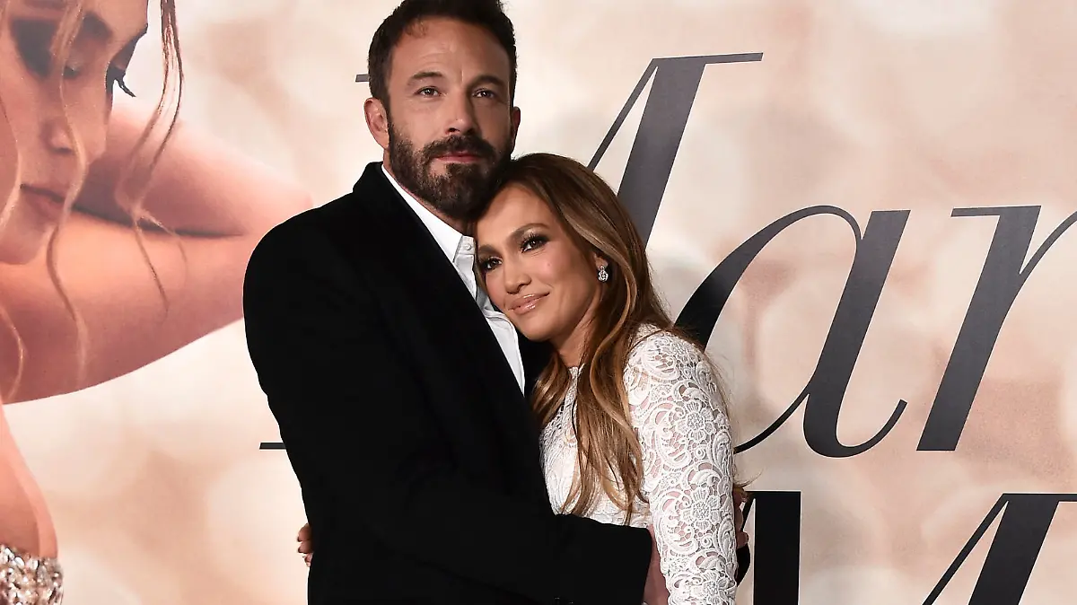 Cast member Jennifer Lopez, right, and Ben Affleck attend a photo call for a special screening of "Marry Me" at DGA Theater on Tuesday, Feb. 8, 2022, in Los Angeles. (Photo by Jordan Strauss/Invision/AP)
