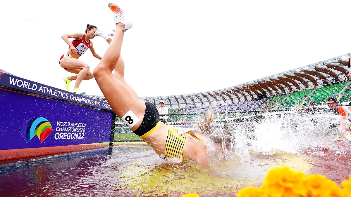 World Athletics Championships Oregon22 - Day Two - Eugene. Germany's Lea Meyer falls into the water whilst competing in the Women's 3000 Metres Steeplechase on day two of the World Athletics Championships at Hayward Field, University of Oregon in the United States. Picture date: Saturday July 16, 2022. See PA Story ATHLETICS World. Photo credit should read: Martin Rickett/PA Wire. RESTRICTIONS: Use subject to restrictions. Editorial use only, no commercial use without prior consent from rights holder. URN:67920947