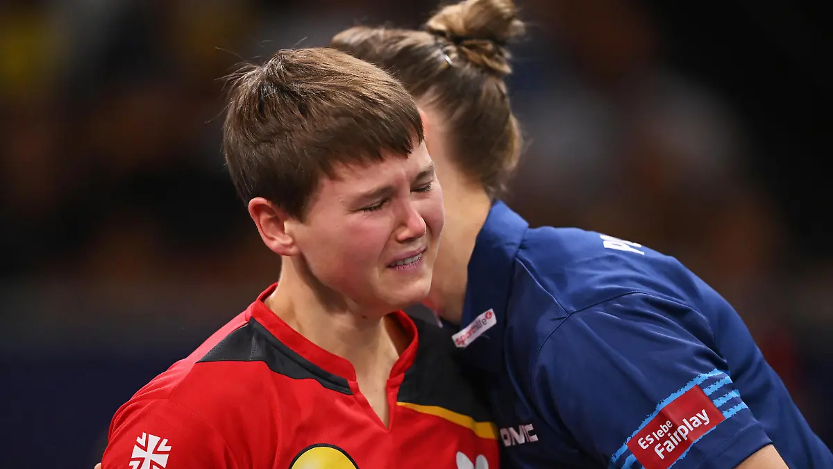 MUNICH, GERMANY - AUGUST 21: Nina Mittelham of Germany reacts upon retiring from the match with an injury, against Sofia Polcanova of Austria during the Women's Singles Gold Medal Match on day 11 of the European Championships Munich 2022 at Rudi-Sedlmayer-Halle on August 21, 2022 in Munich, Germany. (Photo by Sebastian Widmann/Getty Images)