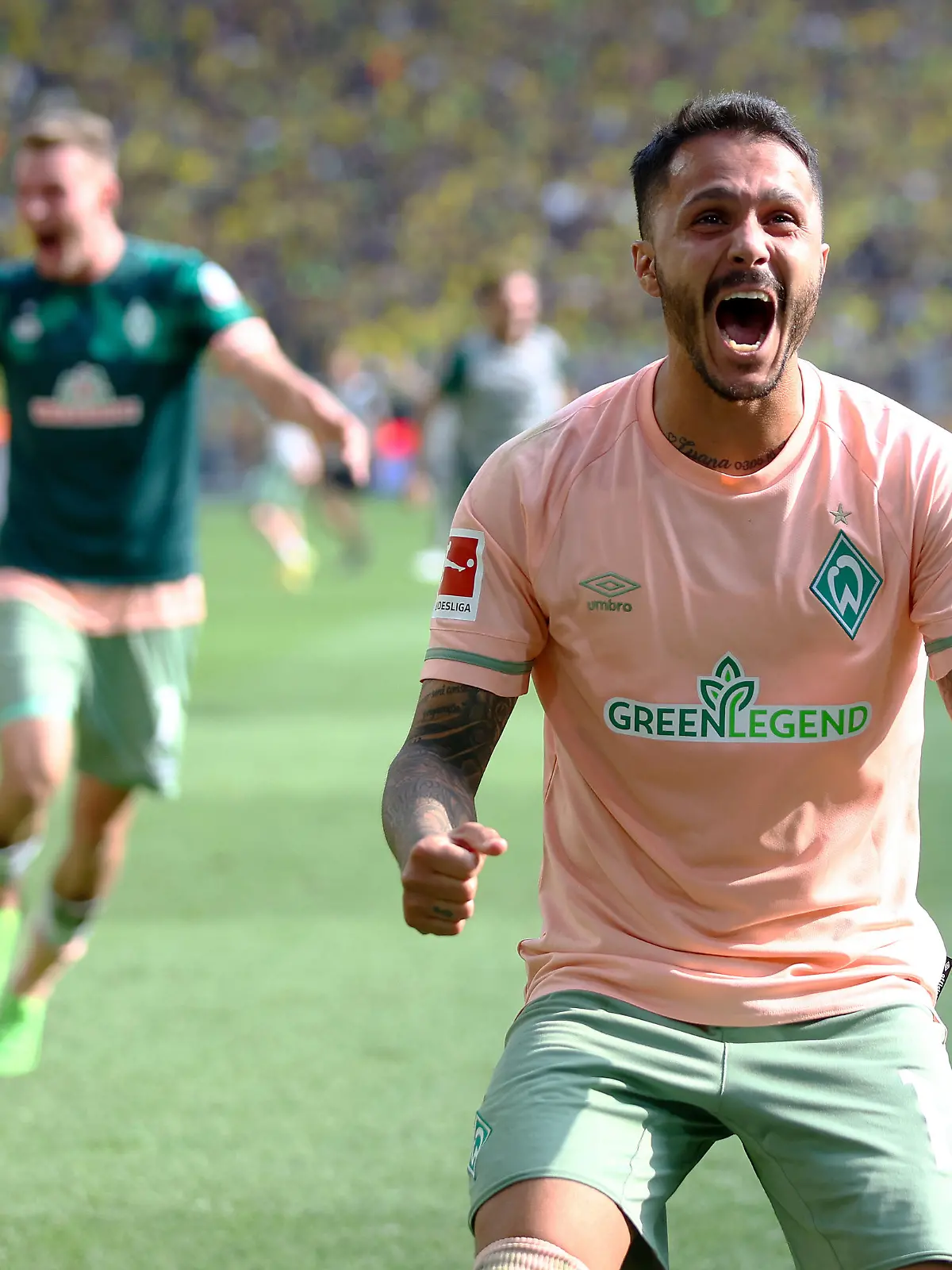 DORTMUND, GERMANY - AUGUST 20: Leonardo Bittencourt of SV Werder Bremen celebrates after teammate Niklas Schmidt scores their team's second goal the during the Bundesliga match between Borussia Dortmund and SV Werder Bremen at Signal Iduna Park on August 20, 2022 in Dortmund, Germany. (Photo by Lars Baron/Getty Images)