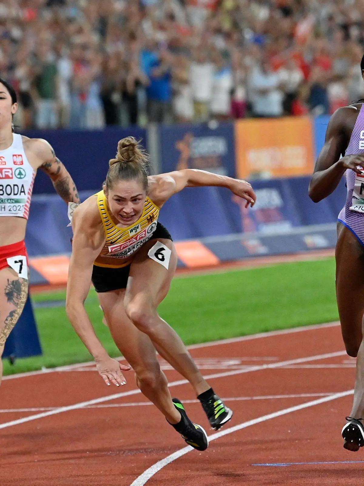 6 August 2022, Bavaria, Munich: European Championships, Athletics,100m, Women, Final at the Olympic Stadium. Gina Luckenkemper (Ct) from Germany finishes ahead of Daryll Neita (R) from Great Britain. Fourth place goes to Ewa Swoboda (L) from Poland//HMCROPIX_Sipa.1673/2208171027/Credit:Ronald Gorsic/CROPIX/SIPA/2208171038