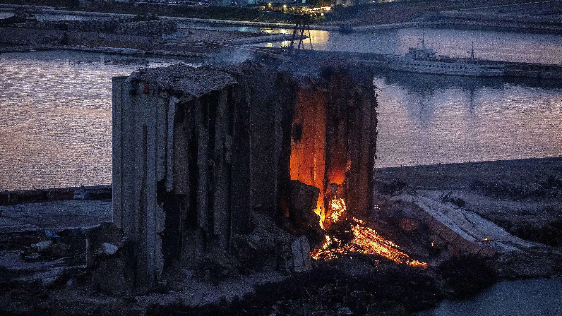 A large fire blaze continues in the grain silos that were heavily damaged in the August 2020 explosion at the port of Beirut, Lebanon, as seen on August 18, 2022. The fire has been on for several weeks and destroyed parts of the silos, that families of victims would like to keep and maintain as a memorial for the August 4, 2020 explosion. Photo by Ammar Abd Rabbo/ABACAPRESS.COM