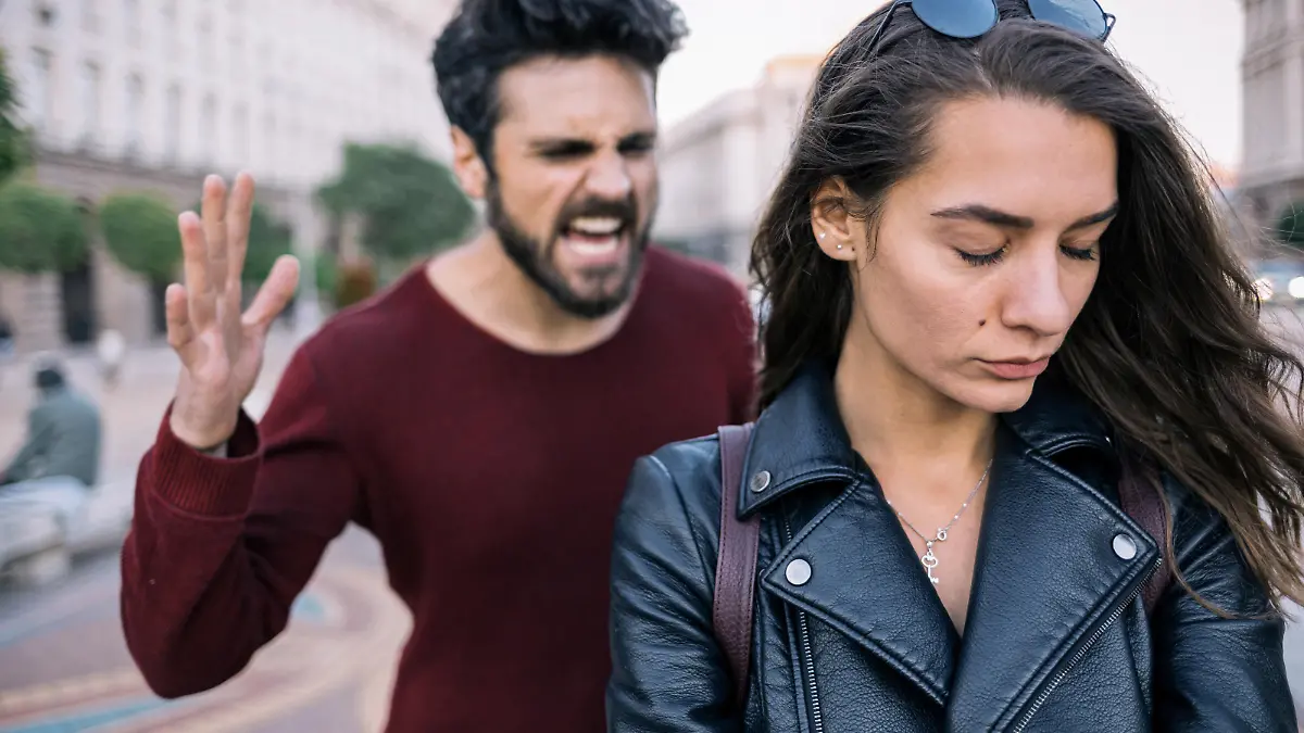 Bearded man shouting at his girlfriend