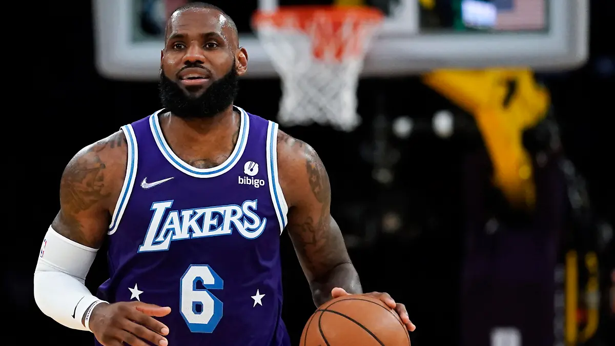 FILE - Los Angeles Lakers forward LeBron James (6) controls the ball during an NBA basketball game against the New Orleans Pelicans in Los Angeles, Friday, April 1, 2022. The NBA schedule comes out Wednesday afternoon, Aug. 17, 2022, and it'll provide the first look at, among other things, when LeBron James might pass Kareem Abdul-Jabbar as the NBA's all-time scoring leader. (AP Photo/Ashley Landis, File)