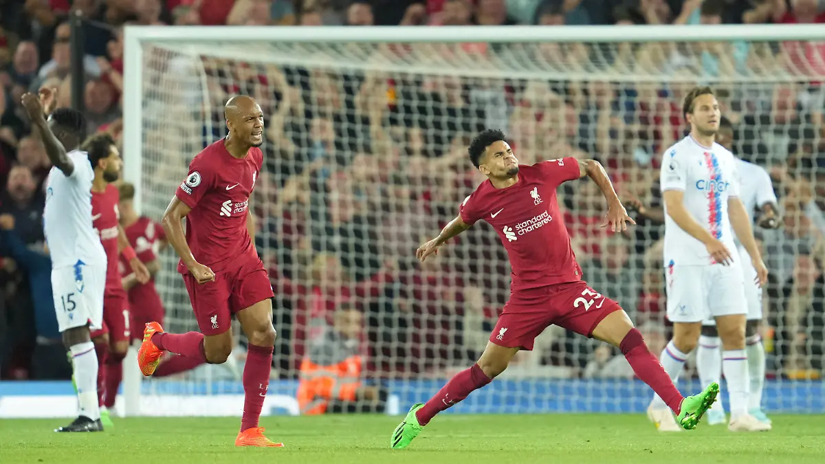 Liverpool's Luis Diaz, right, celebrates after scoring his side's opening goal during the English Premier League soccer match between Liverpool and Crystal Palace at Anfield stadium in Liverpool, England, Monday, Aug. 15, 2022. (AP Photo/Jon Super)